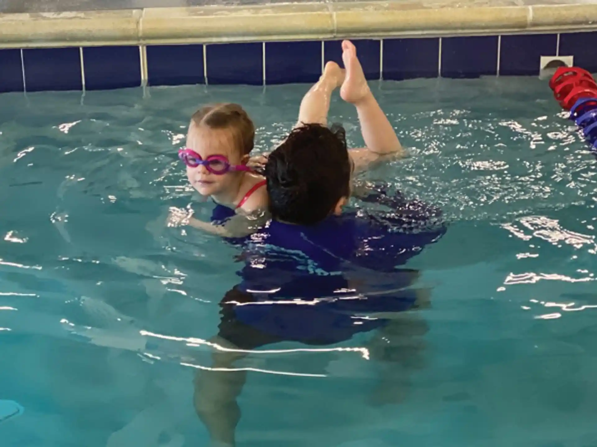 a man and a woman in a pool