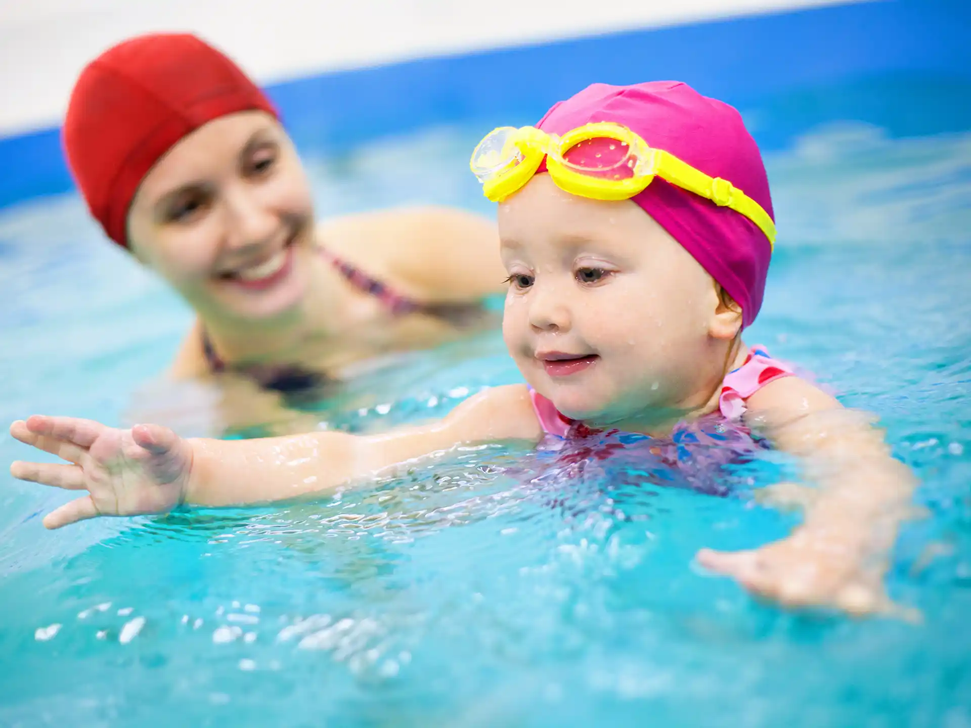 a couple of kids in a pool