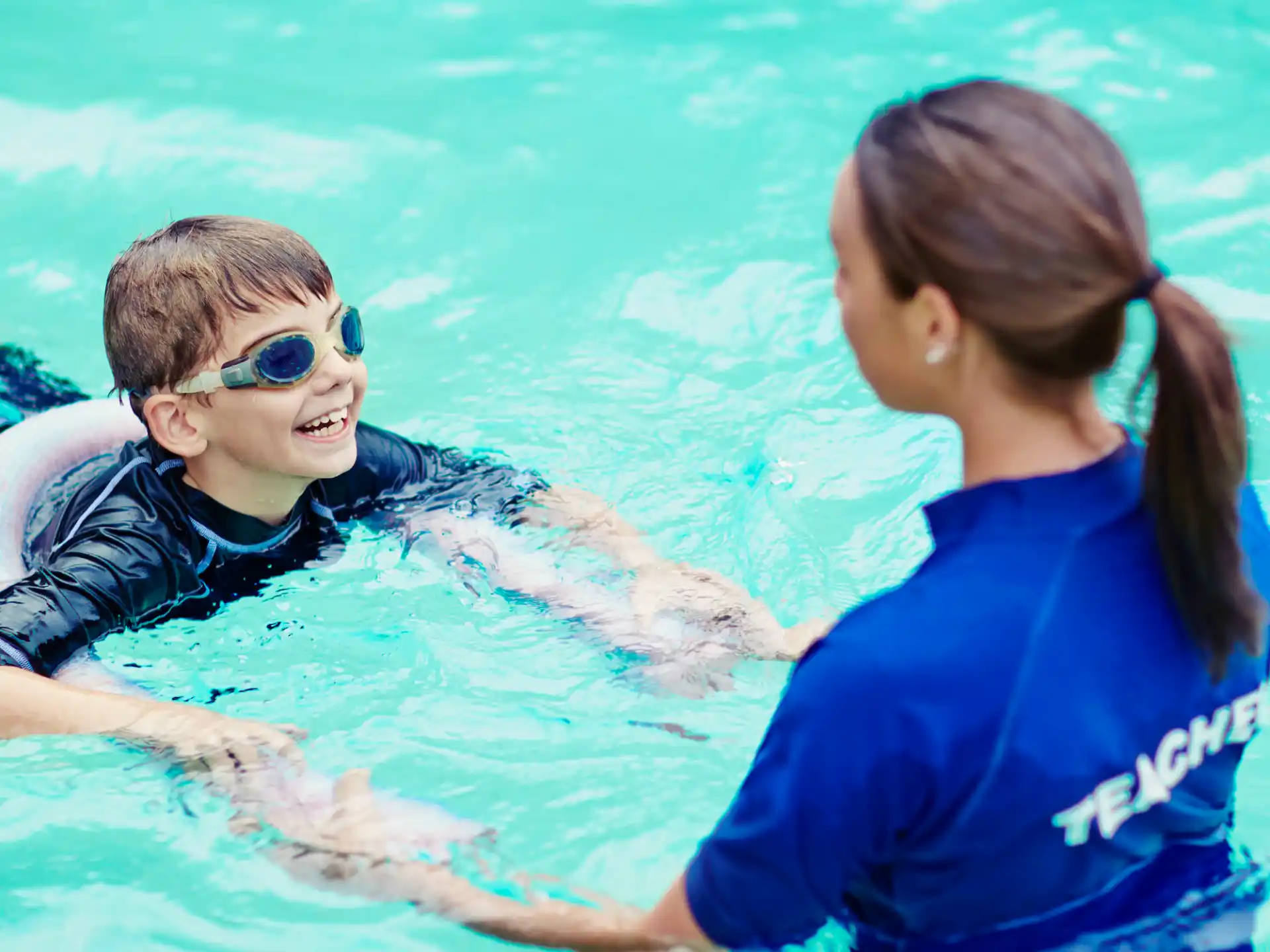 a woman and a man in a pool