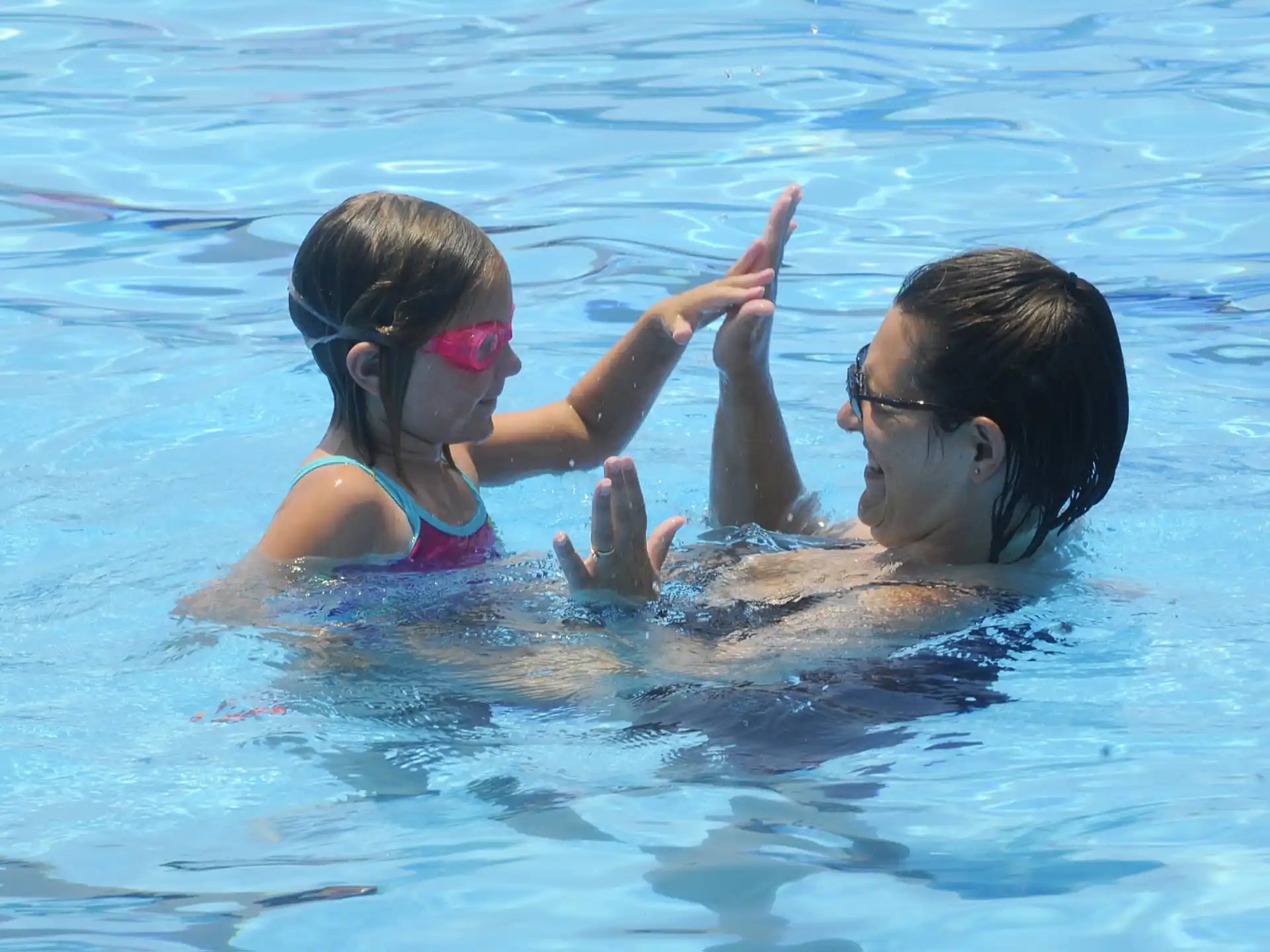 a man and a woman in a pool
