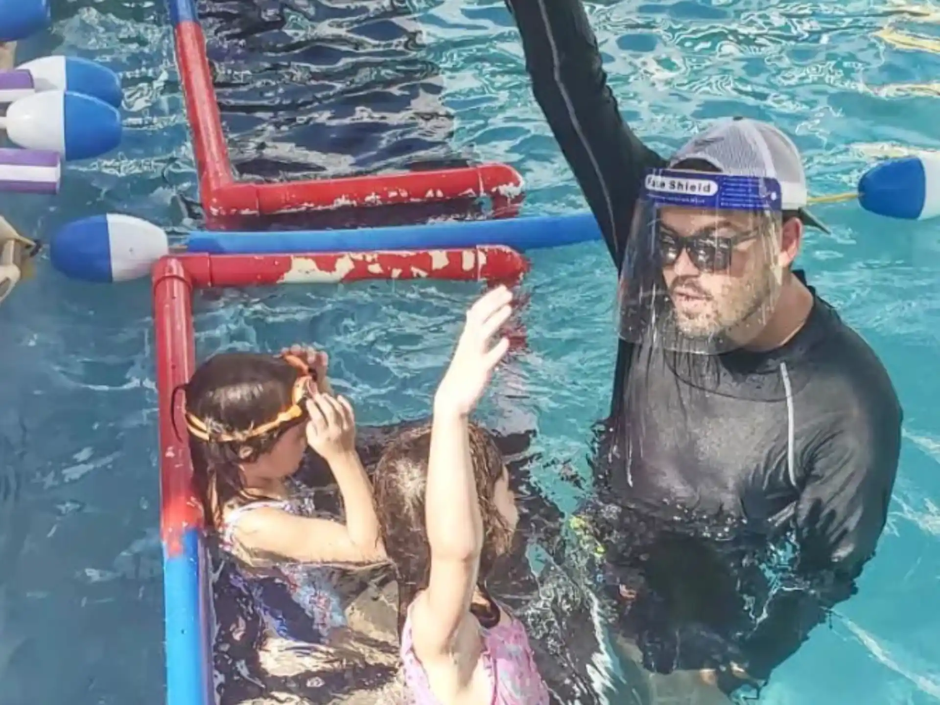 a person and a child in a pool