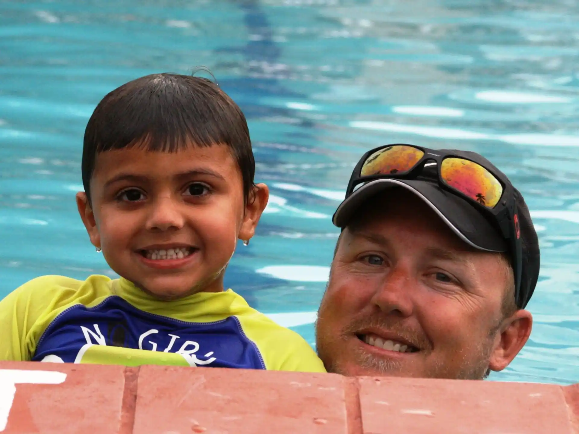 a person and a boy in the water