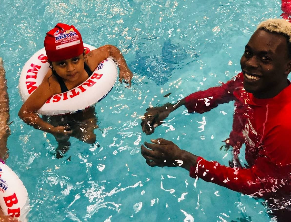 a couple of men in a pool