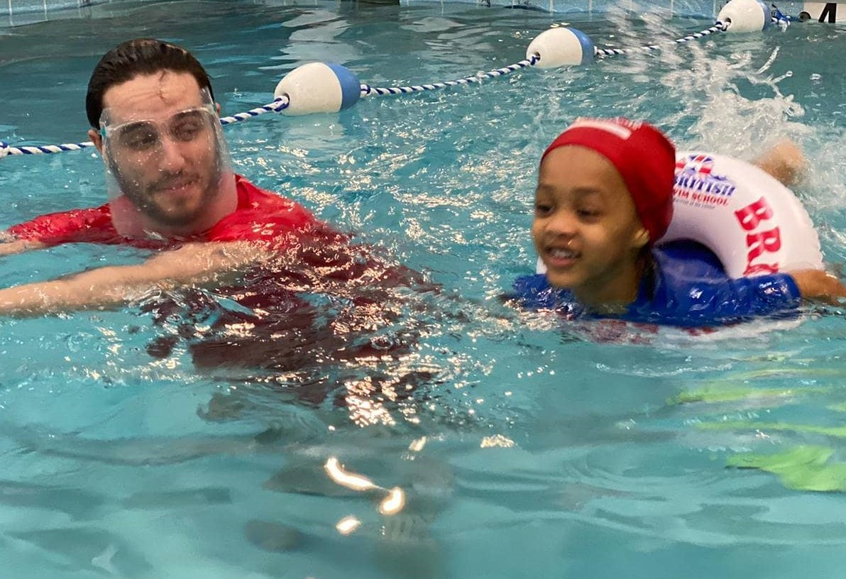 a man and a woman in a pool