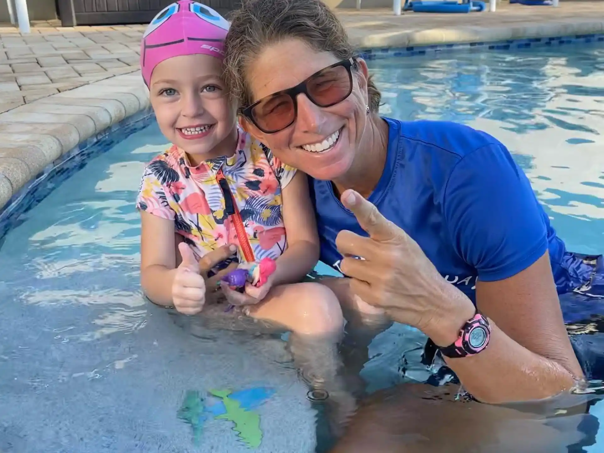 a person and a child in a pool