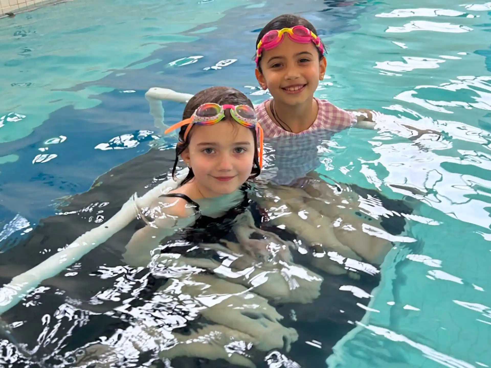 two girls in a pool