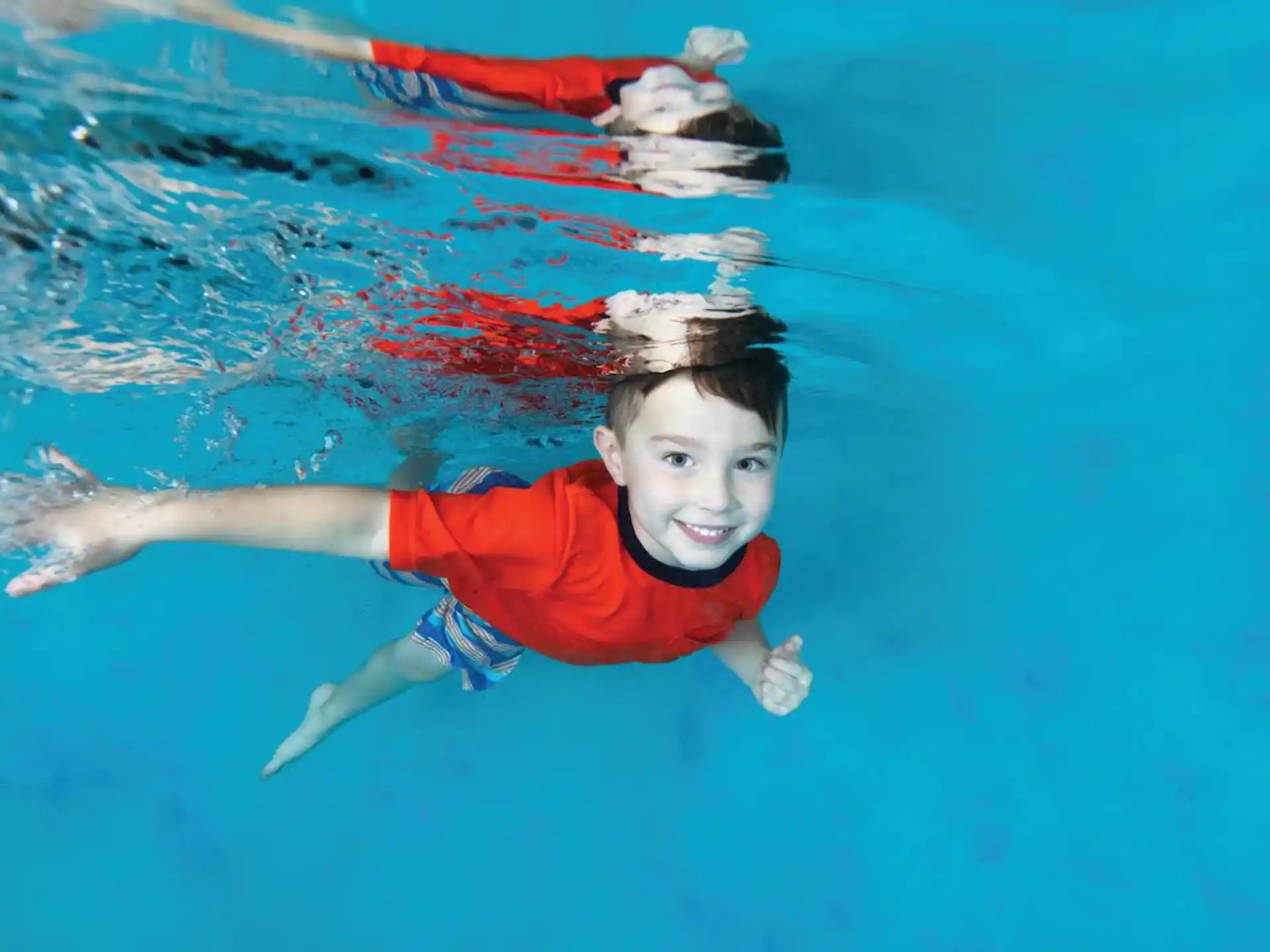 a boy in a pool