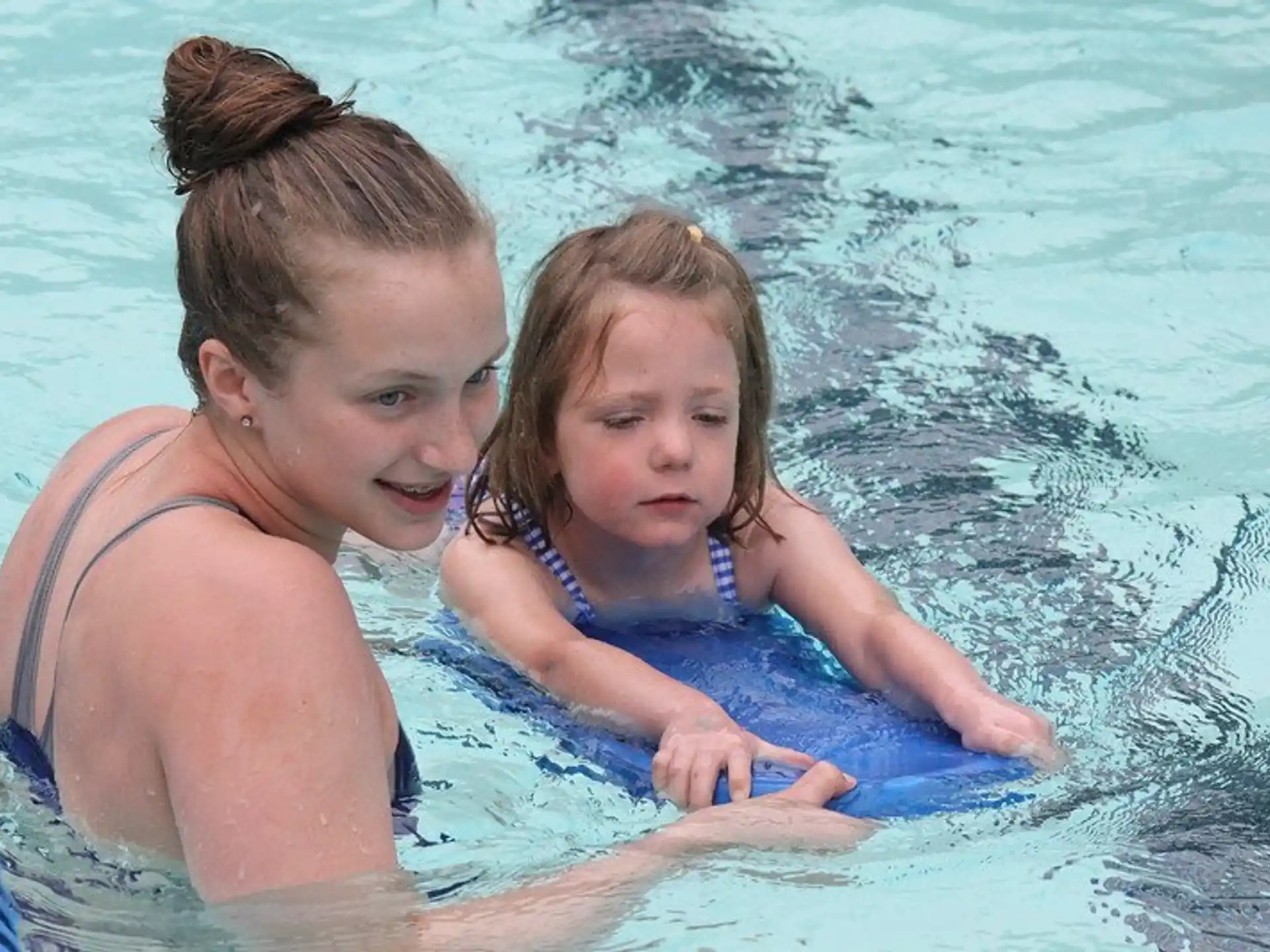 a woman and a girl in the water