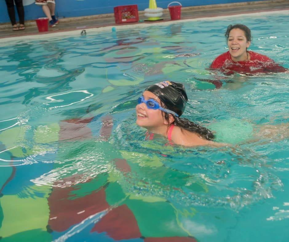 a couple of women in a pool