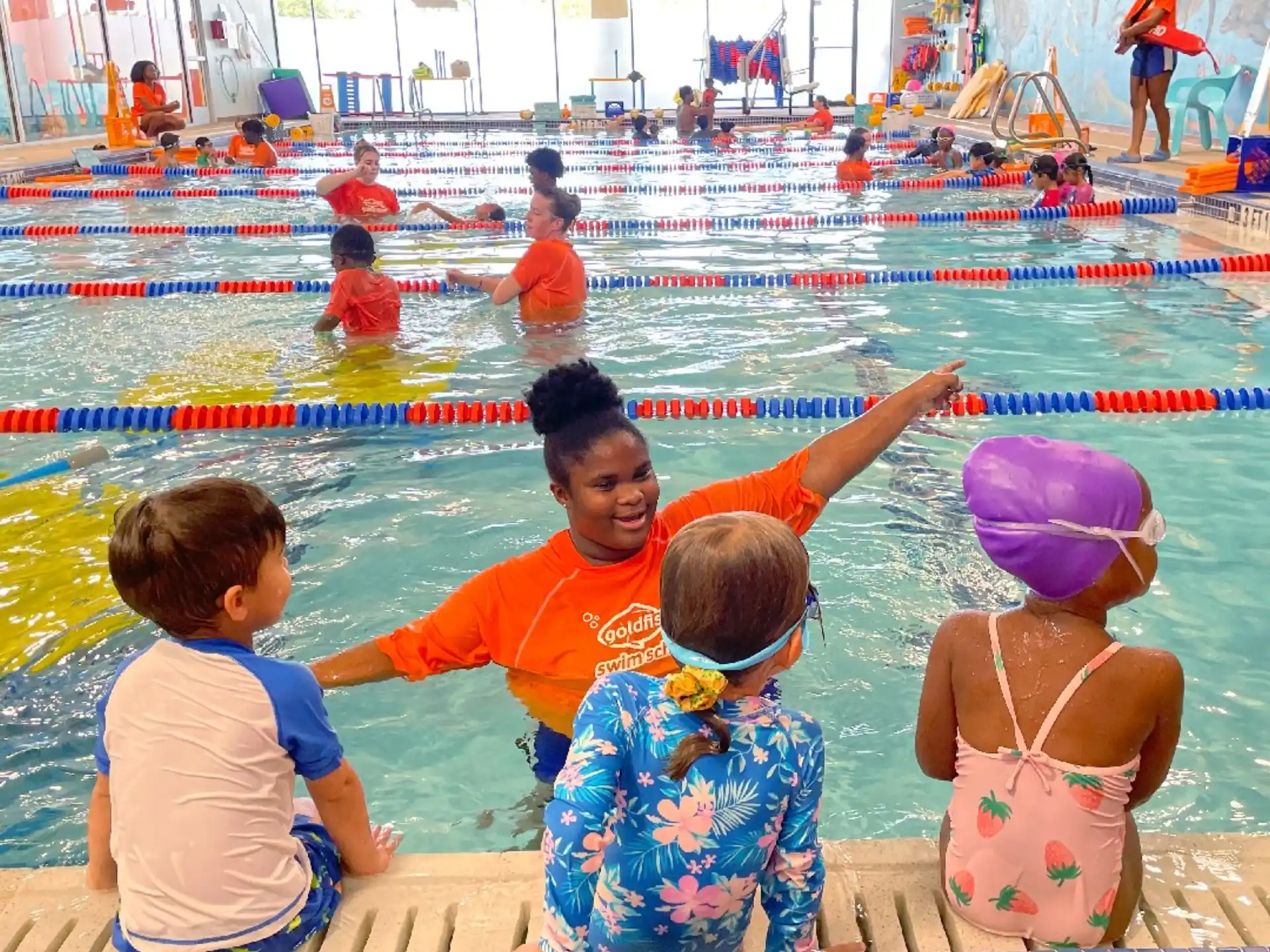 a group of children in a pool