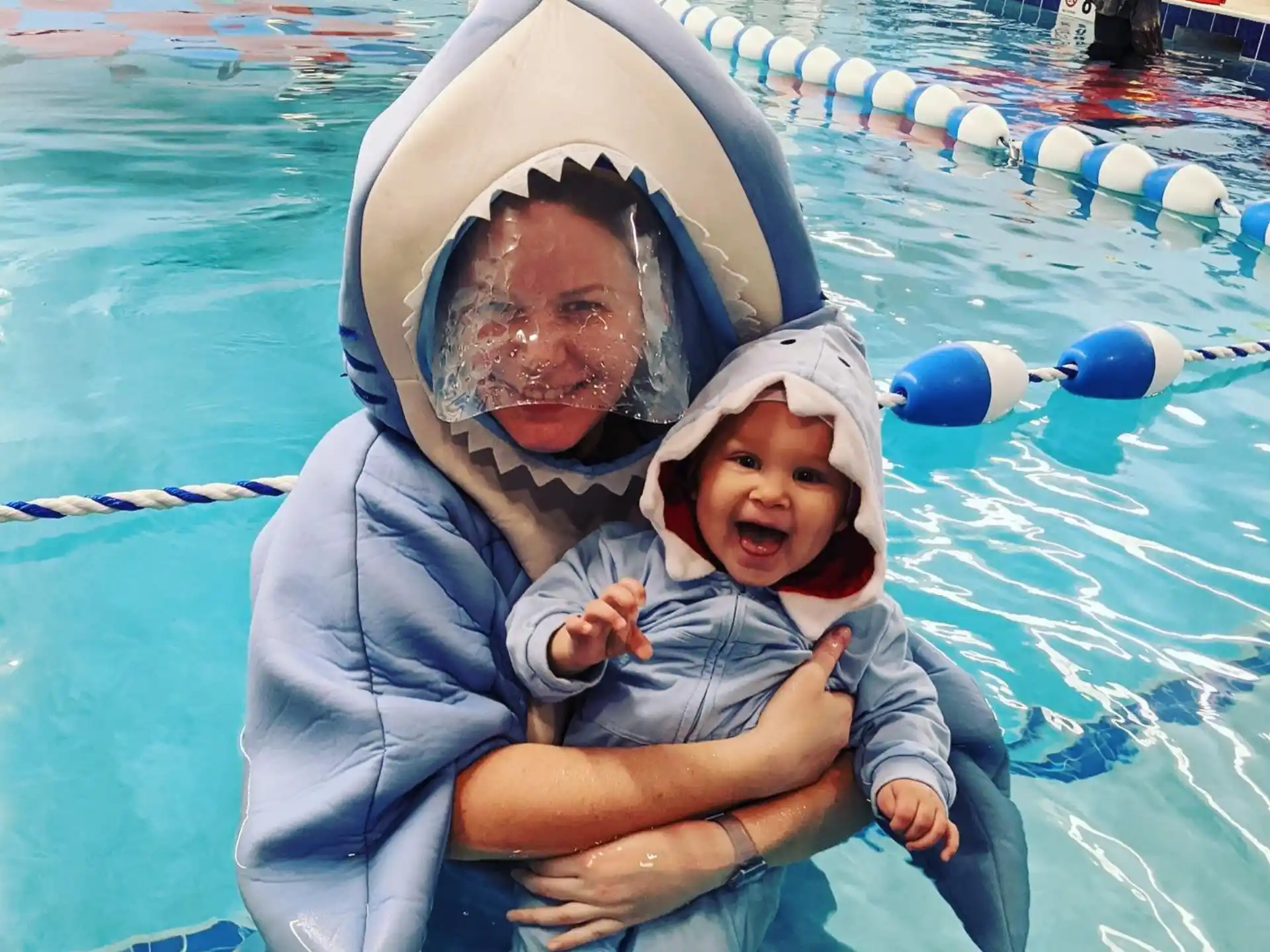 a person and a child in a pool
