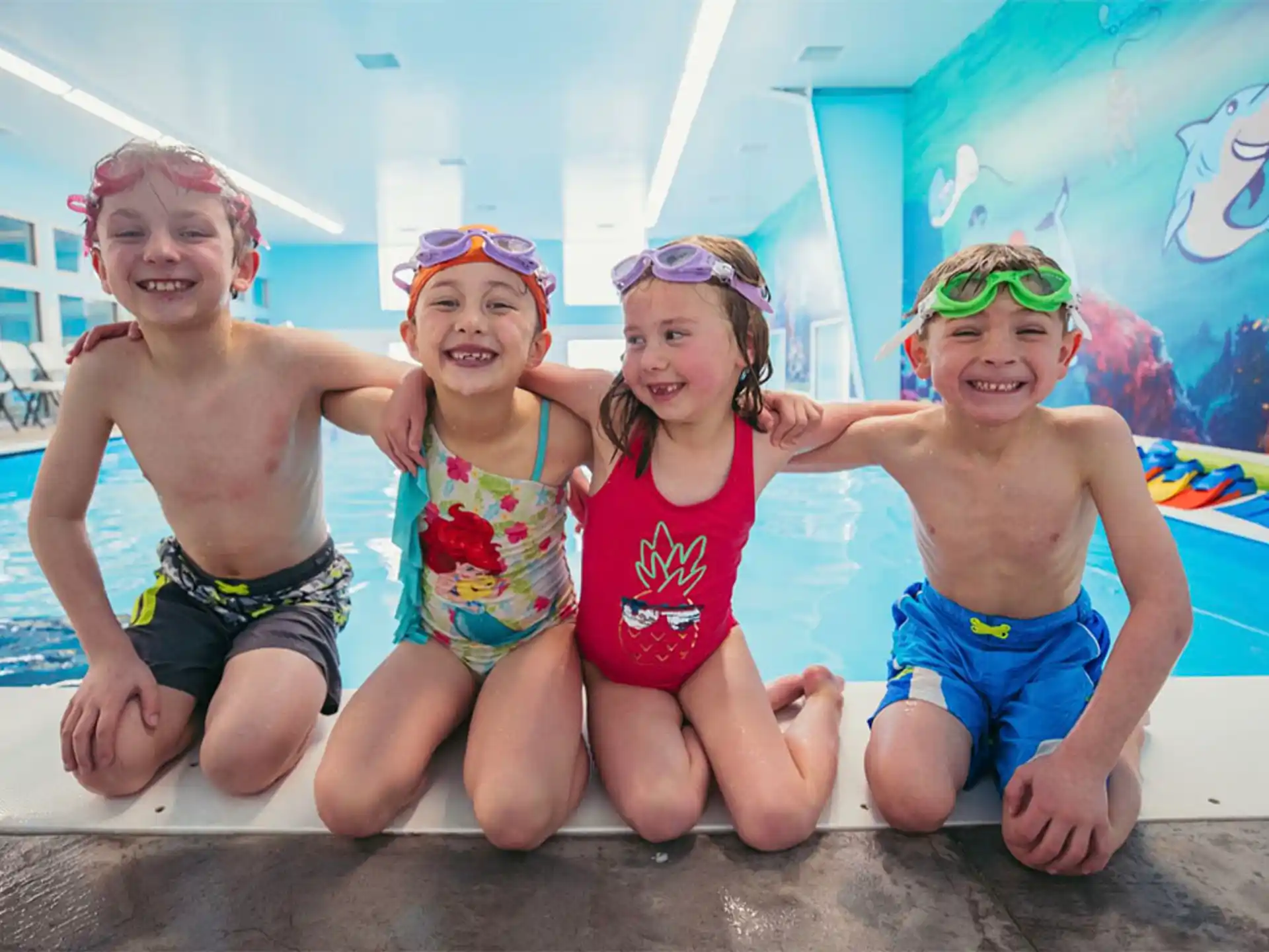 a group of children in a pool