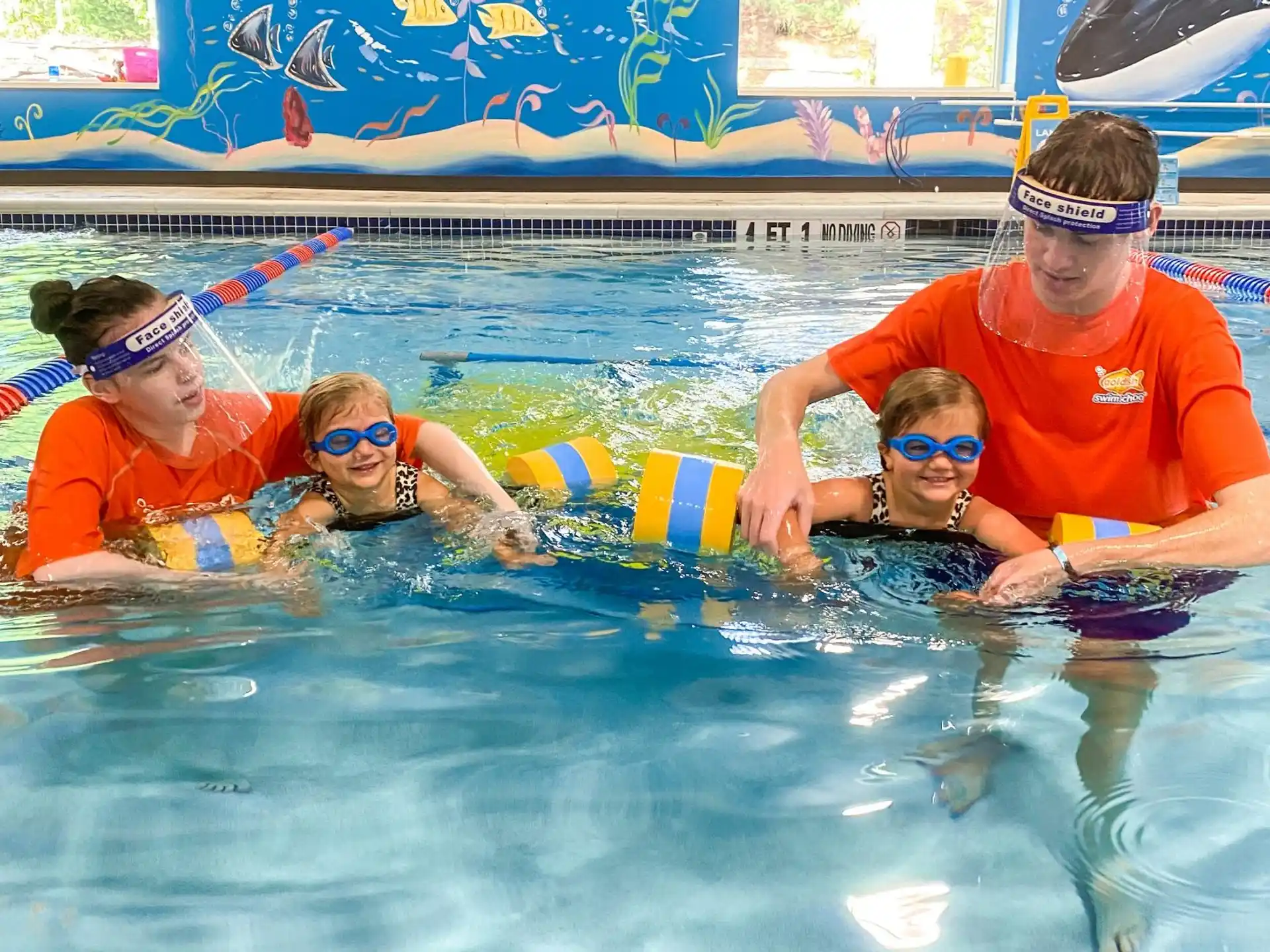 a group of people in a pool