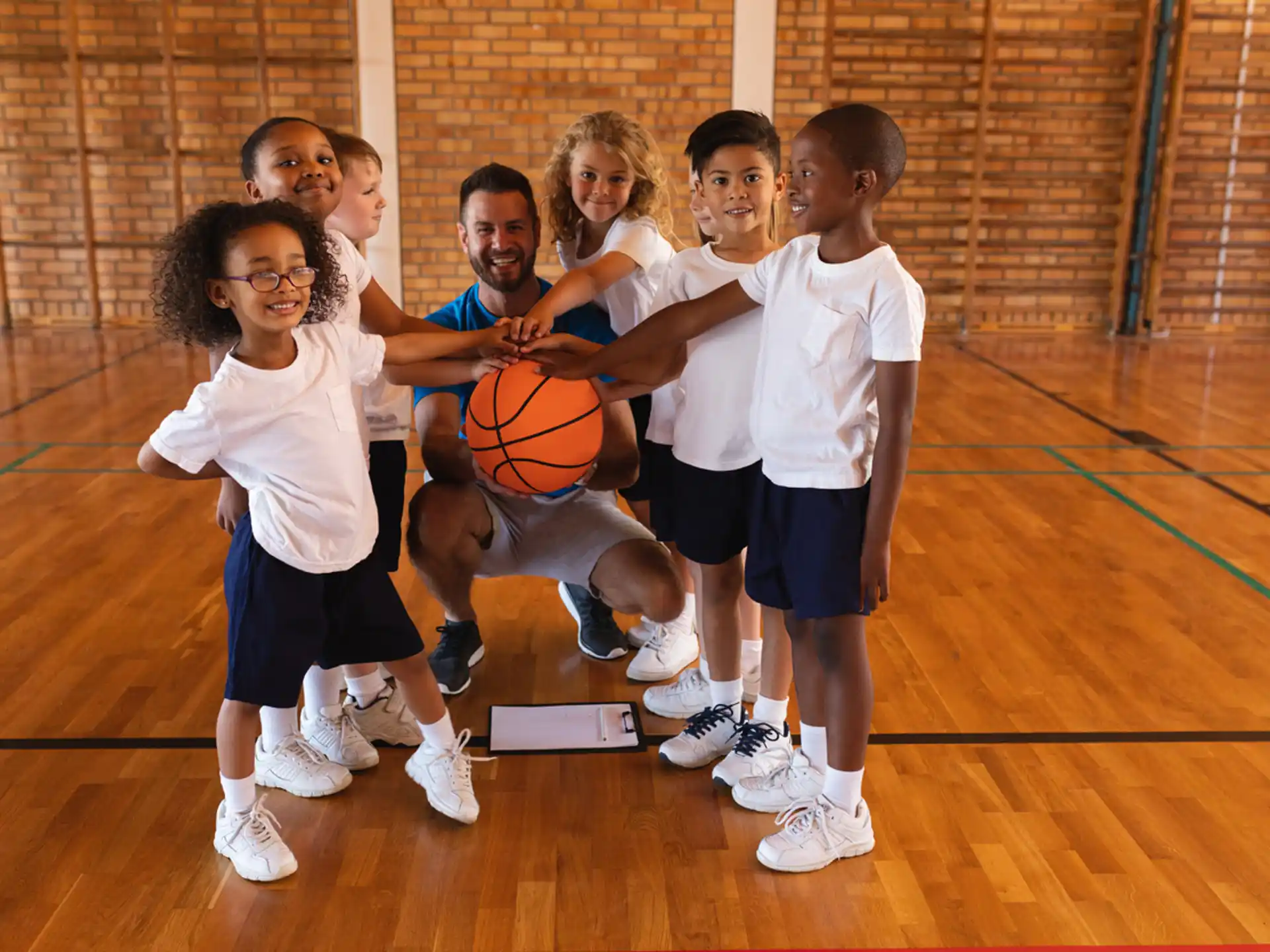 a group of kids holding basketballs