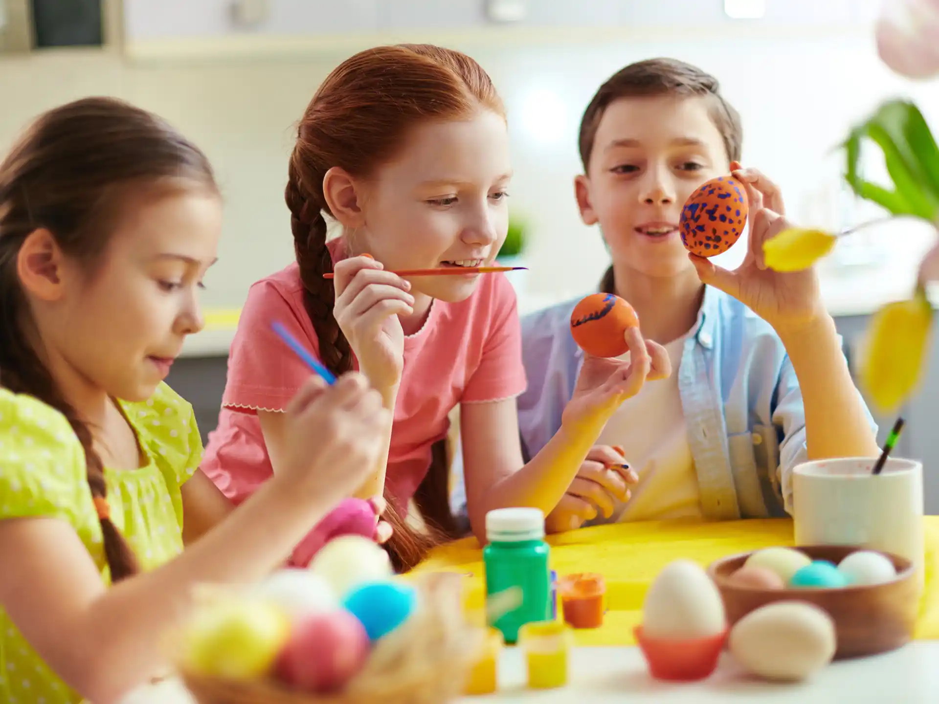 a group of children painting