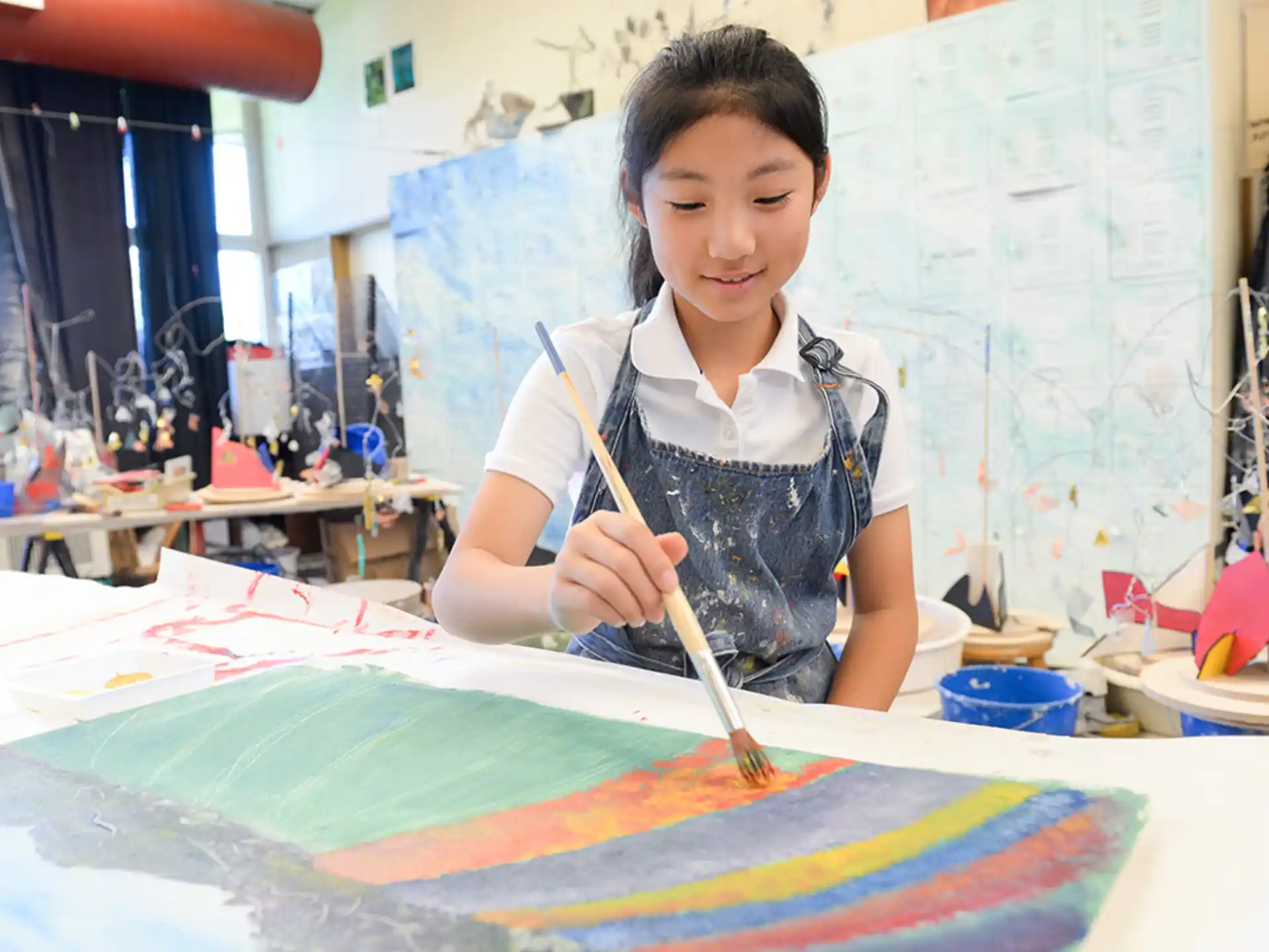 a young girl painting