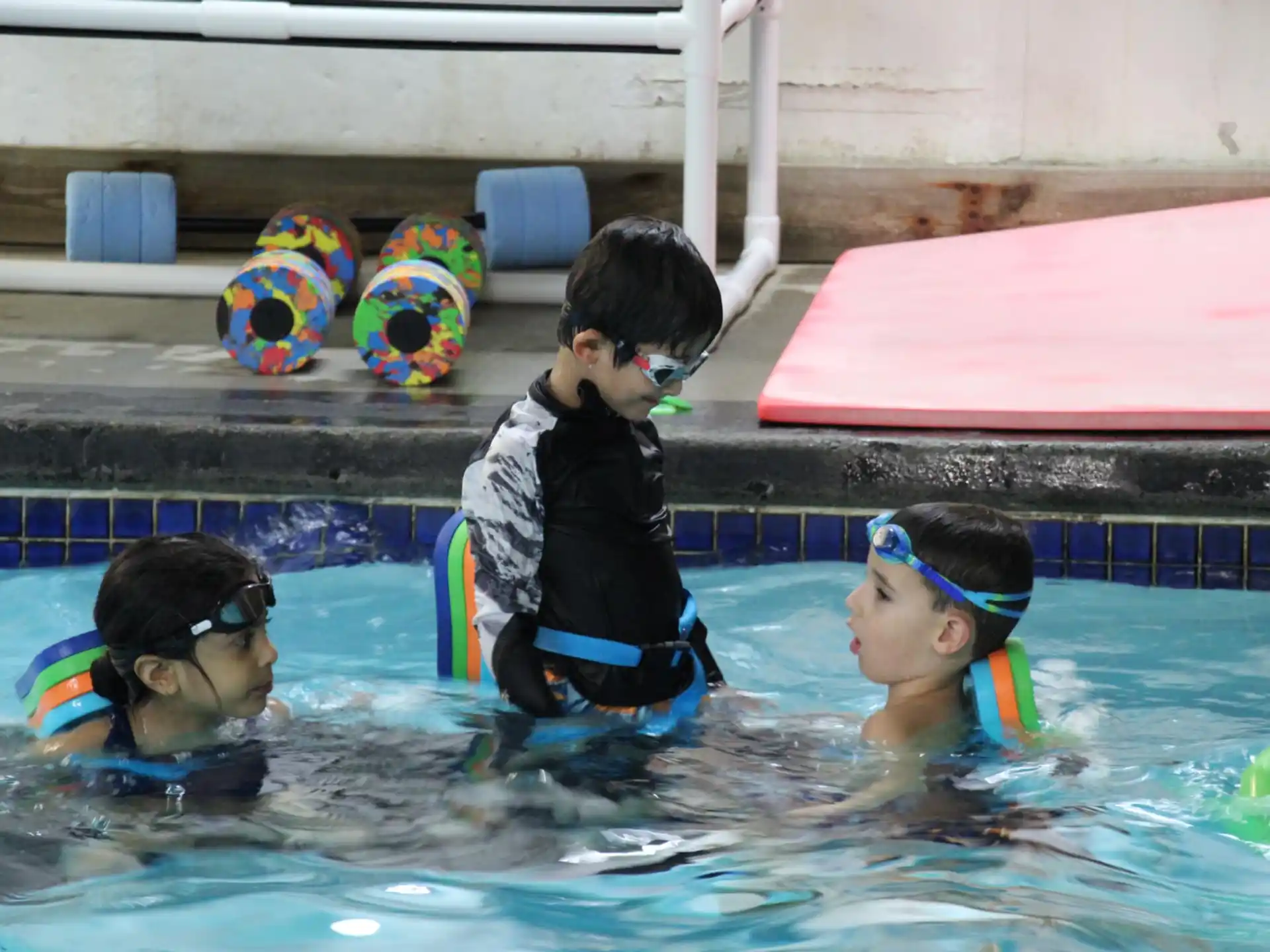 a group of kids in a pool