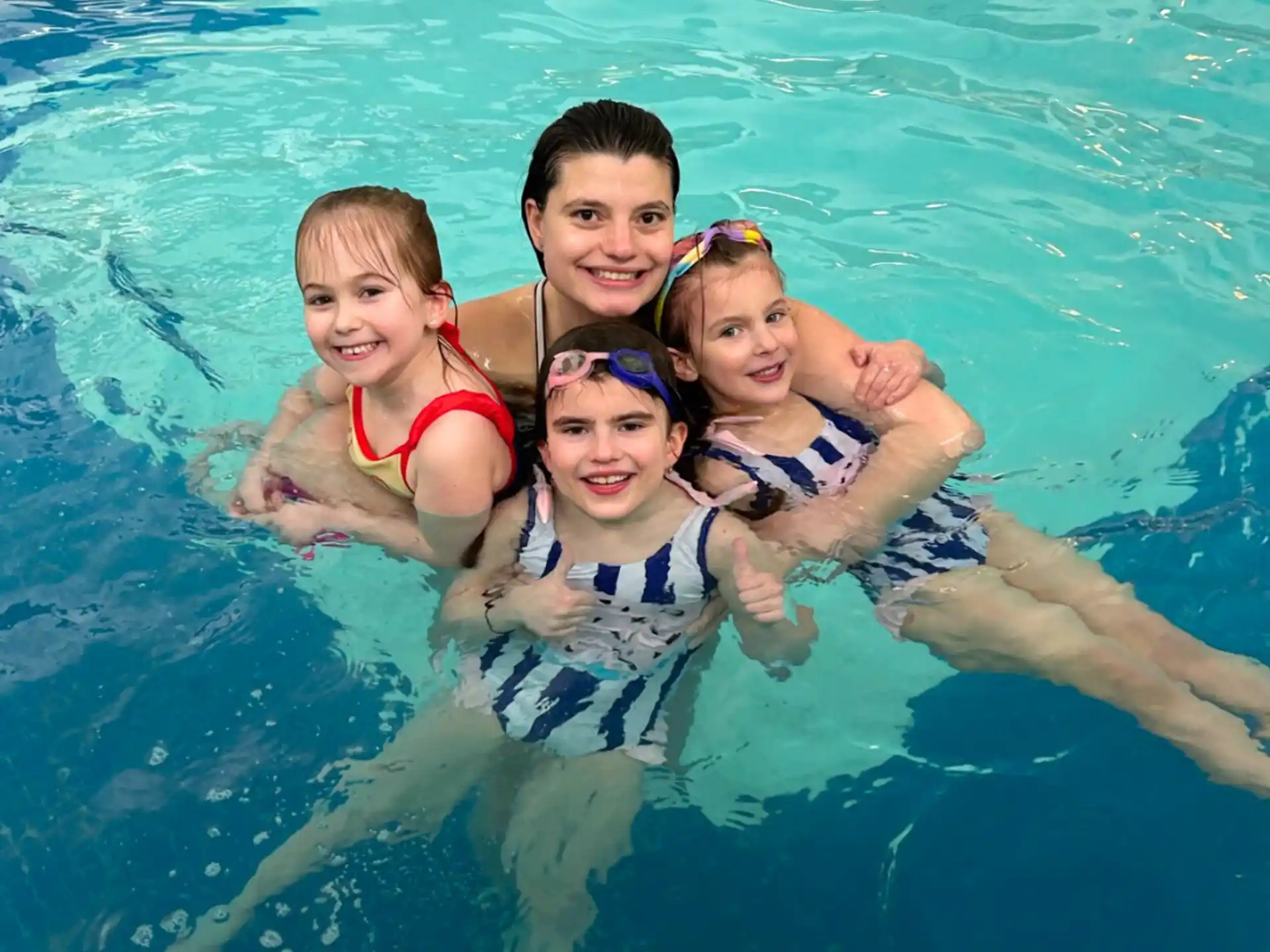 a group of people in a pool