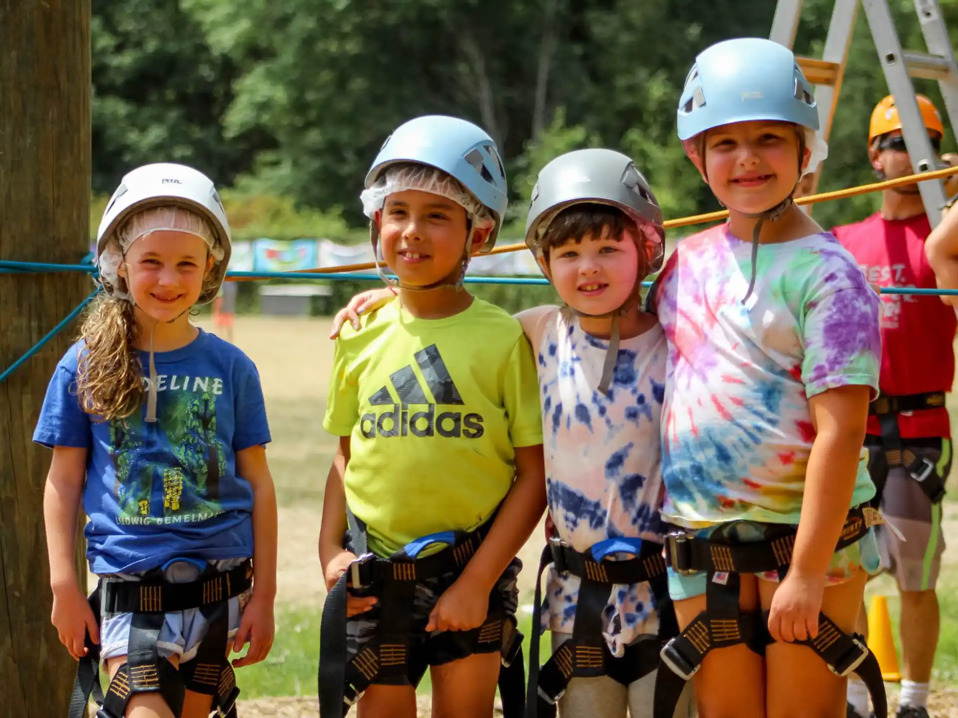 a group of children wearing helmets