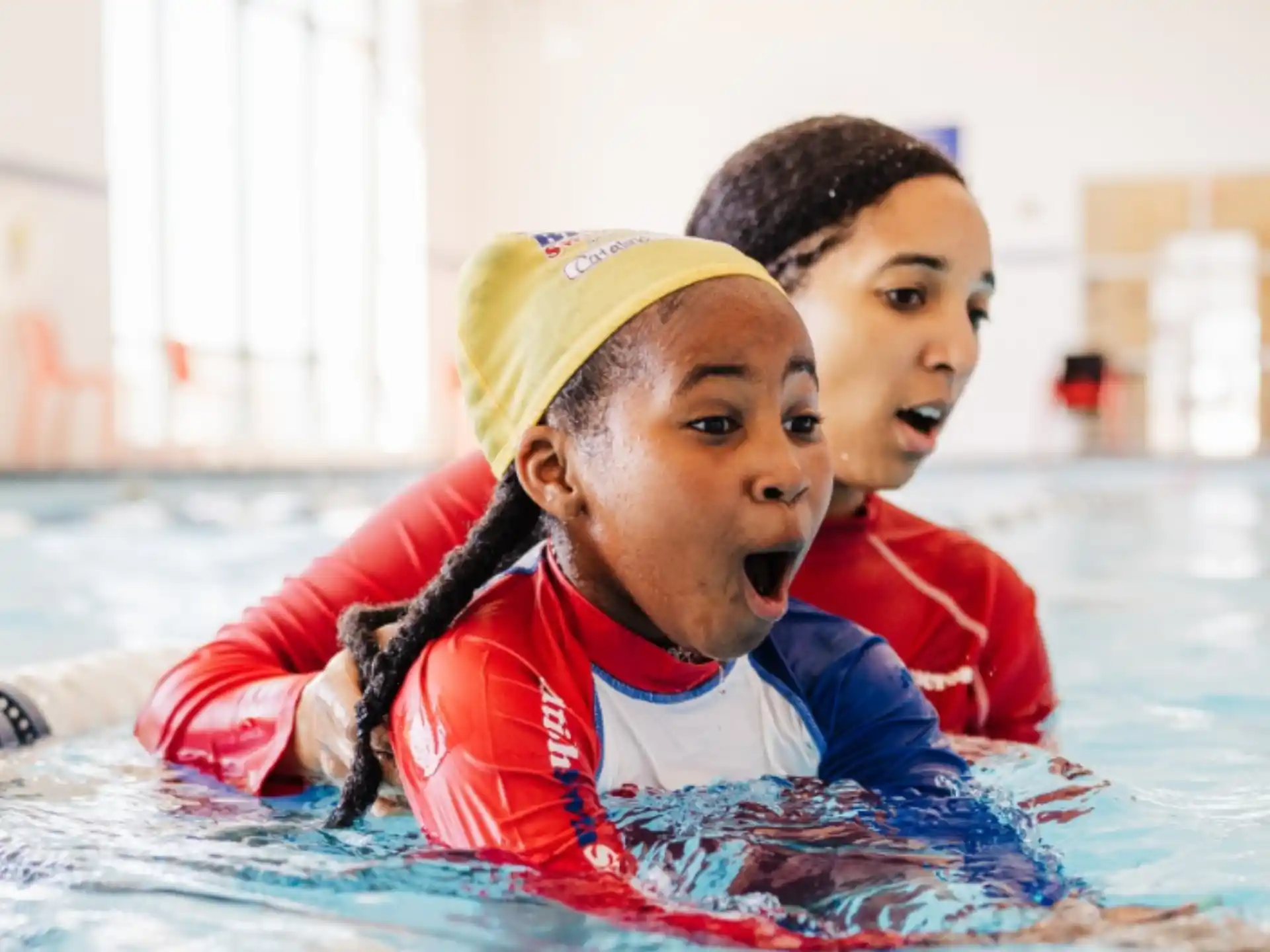 a few kids in a pool