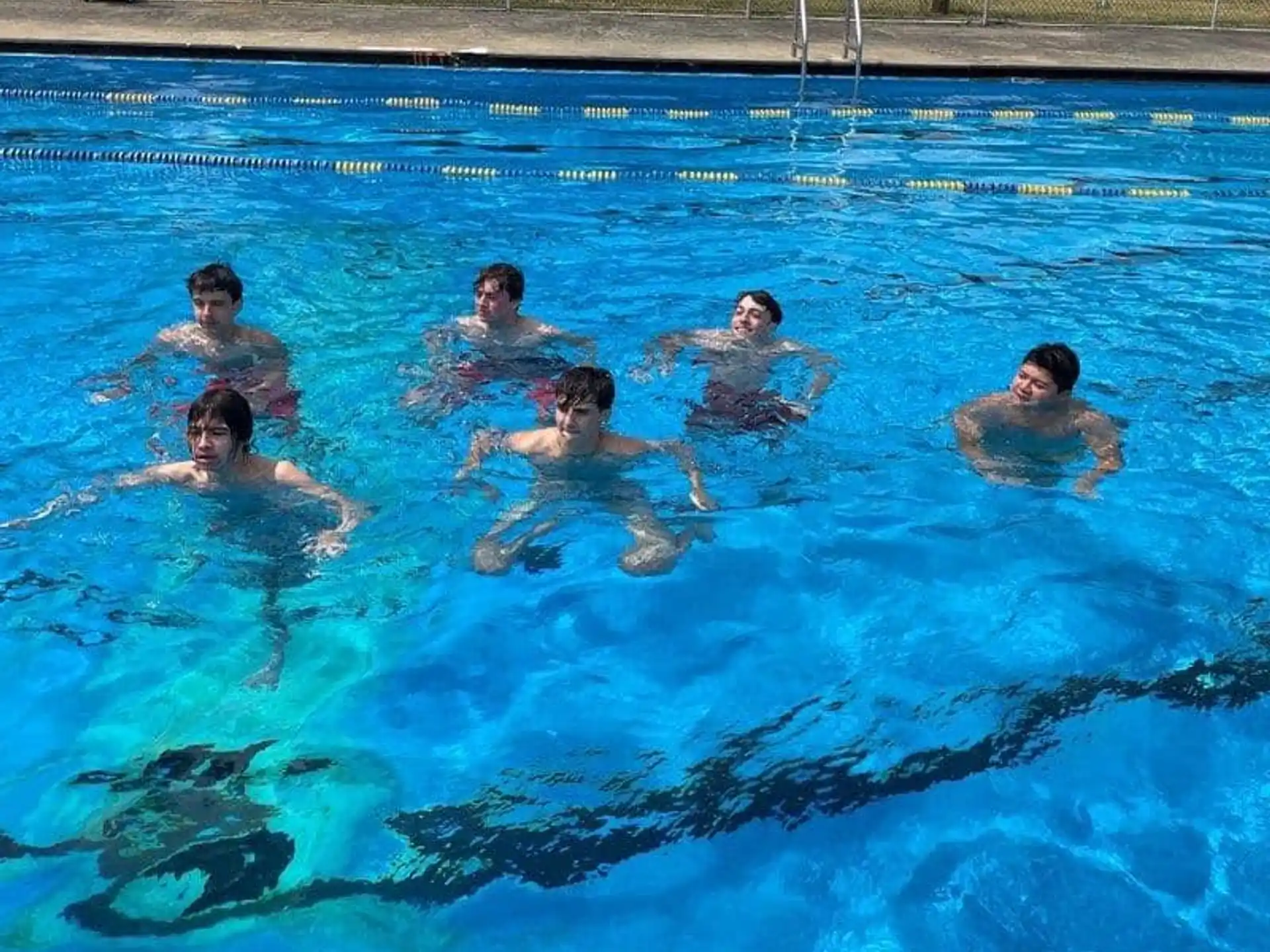 a group of people in a pool