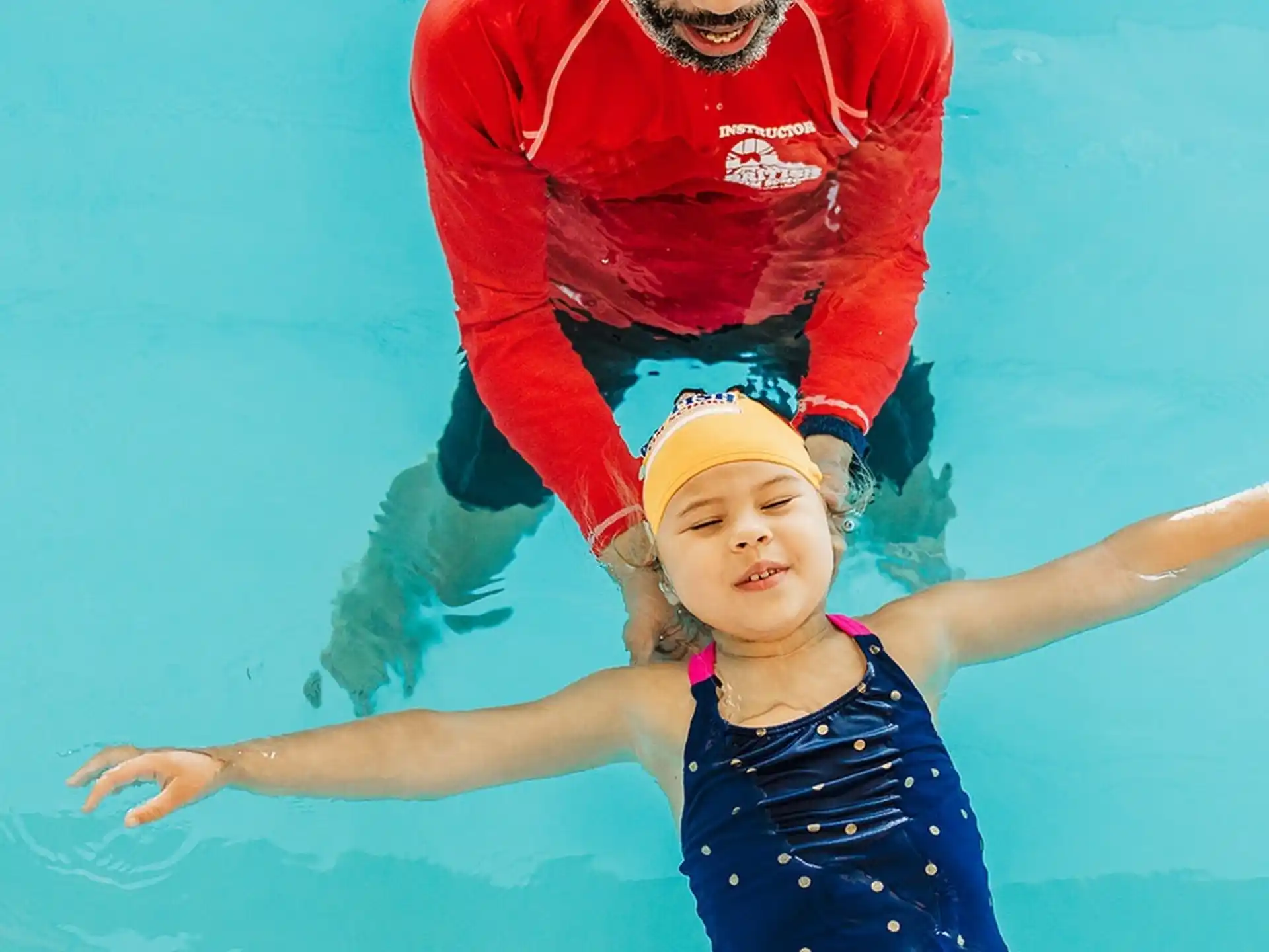 a man and a girl in the water