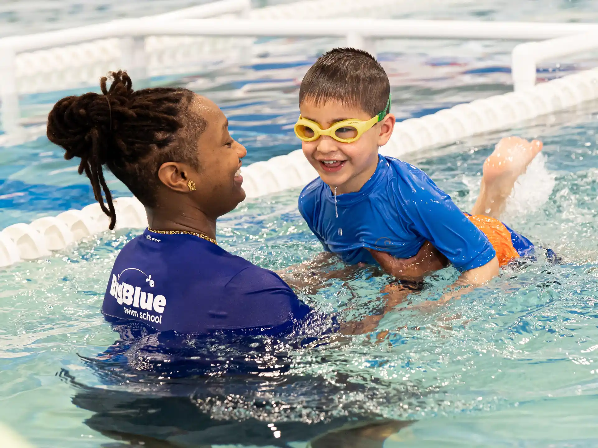 a couple of kids in a pool