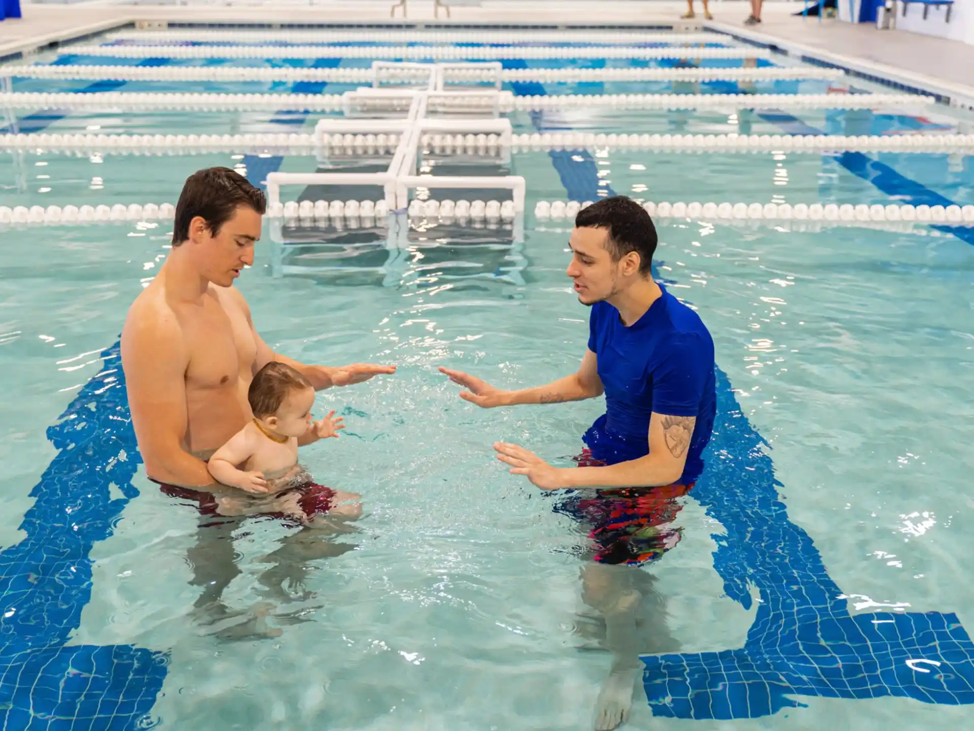 a couple of men in a pool