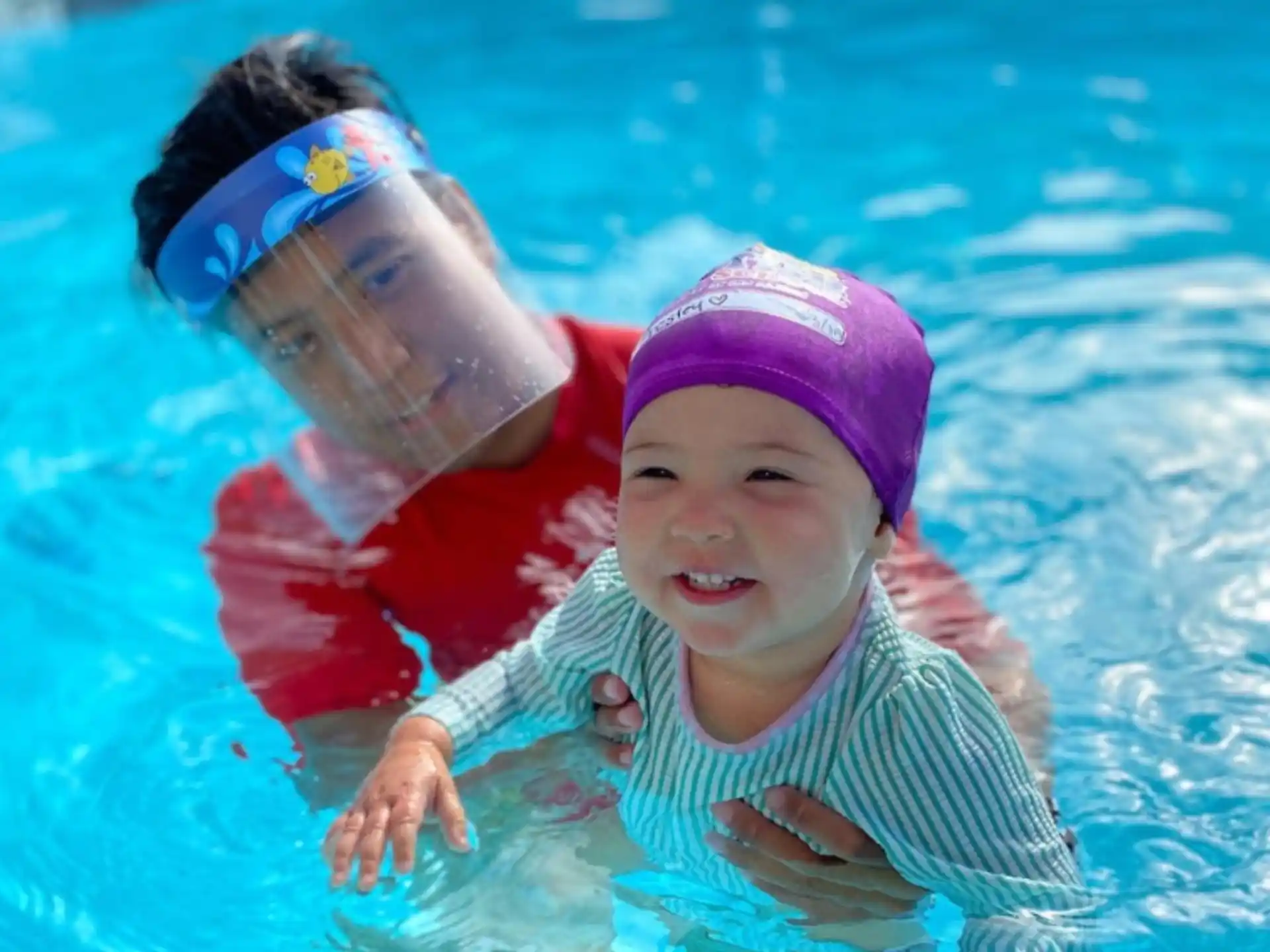 a baby in a pool