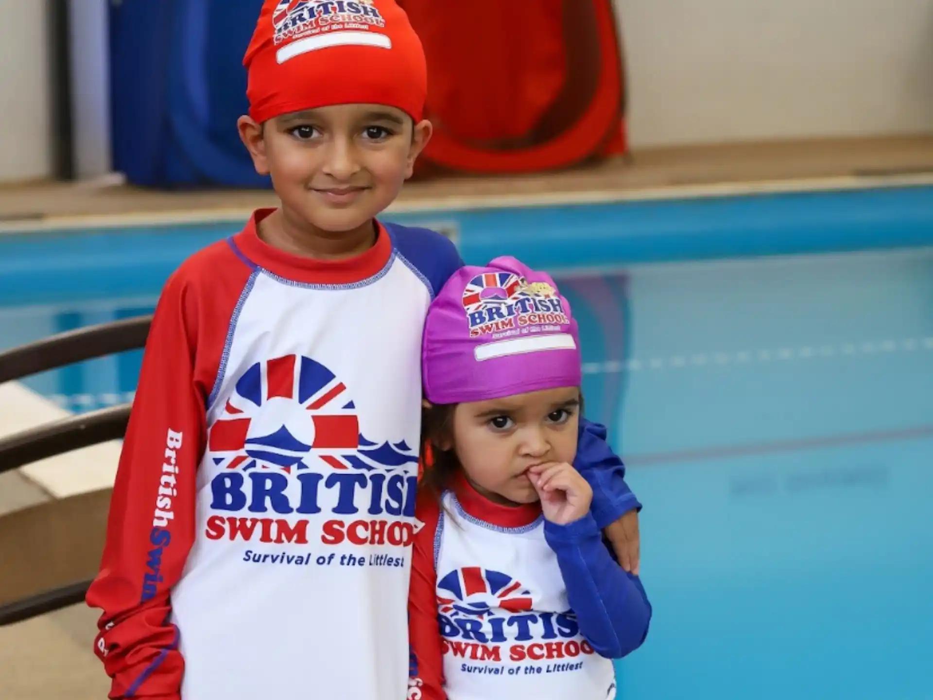 a couple of children posing for the camera