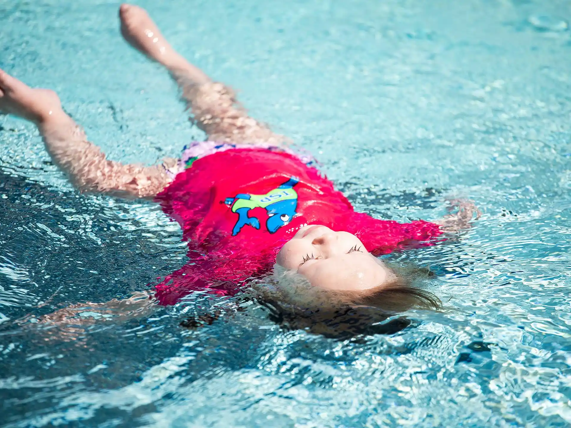 a person swimming in a pool