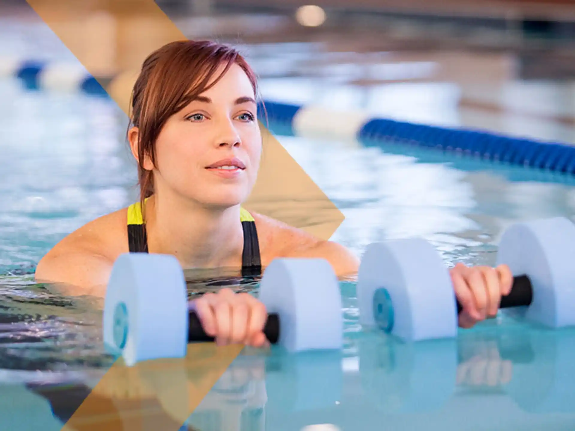 a person in a pool holding a paddle