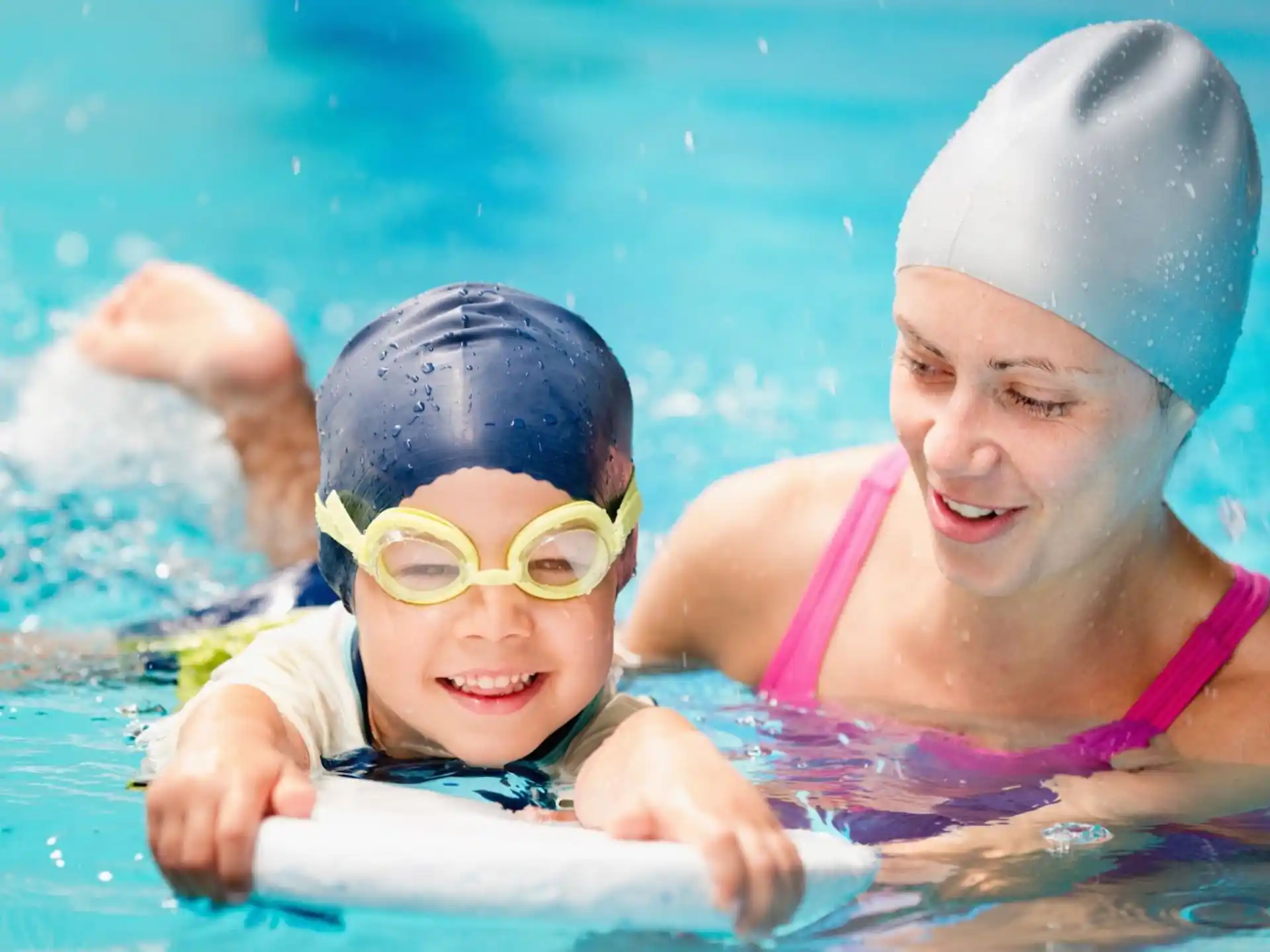a couple of kids in a pool