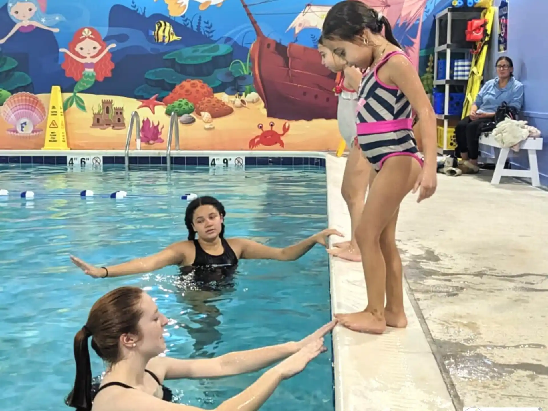 a group of women in a pool