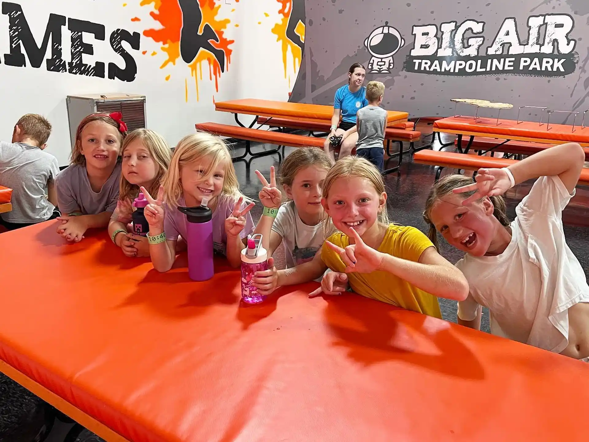 a group of children eating at a table