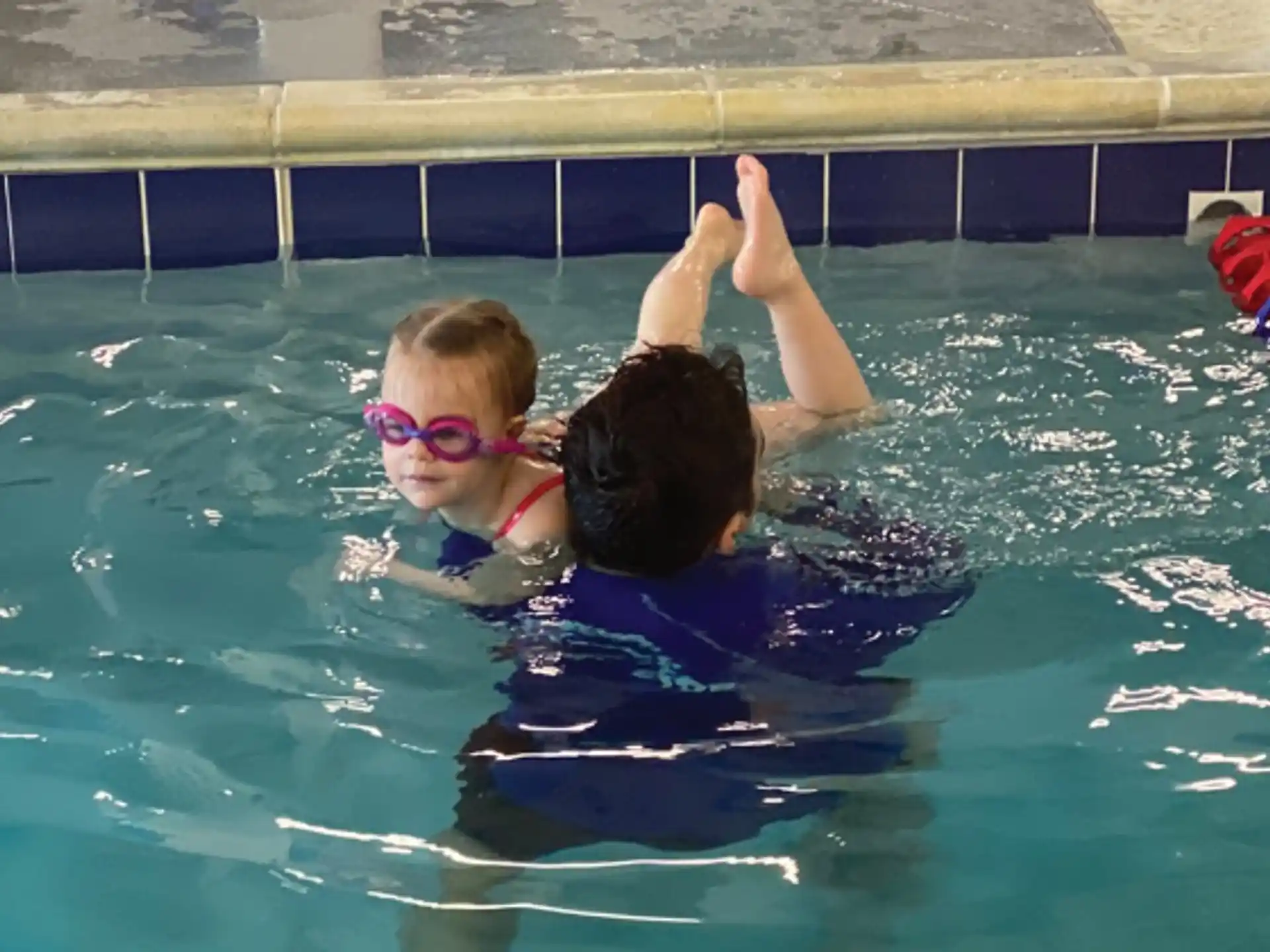 a man and a woman in a pool