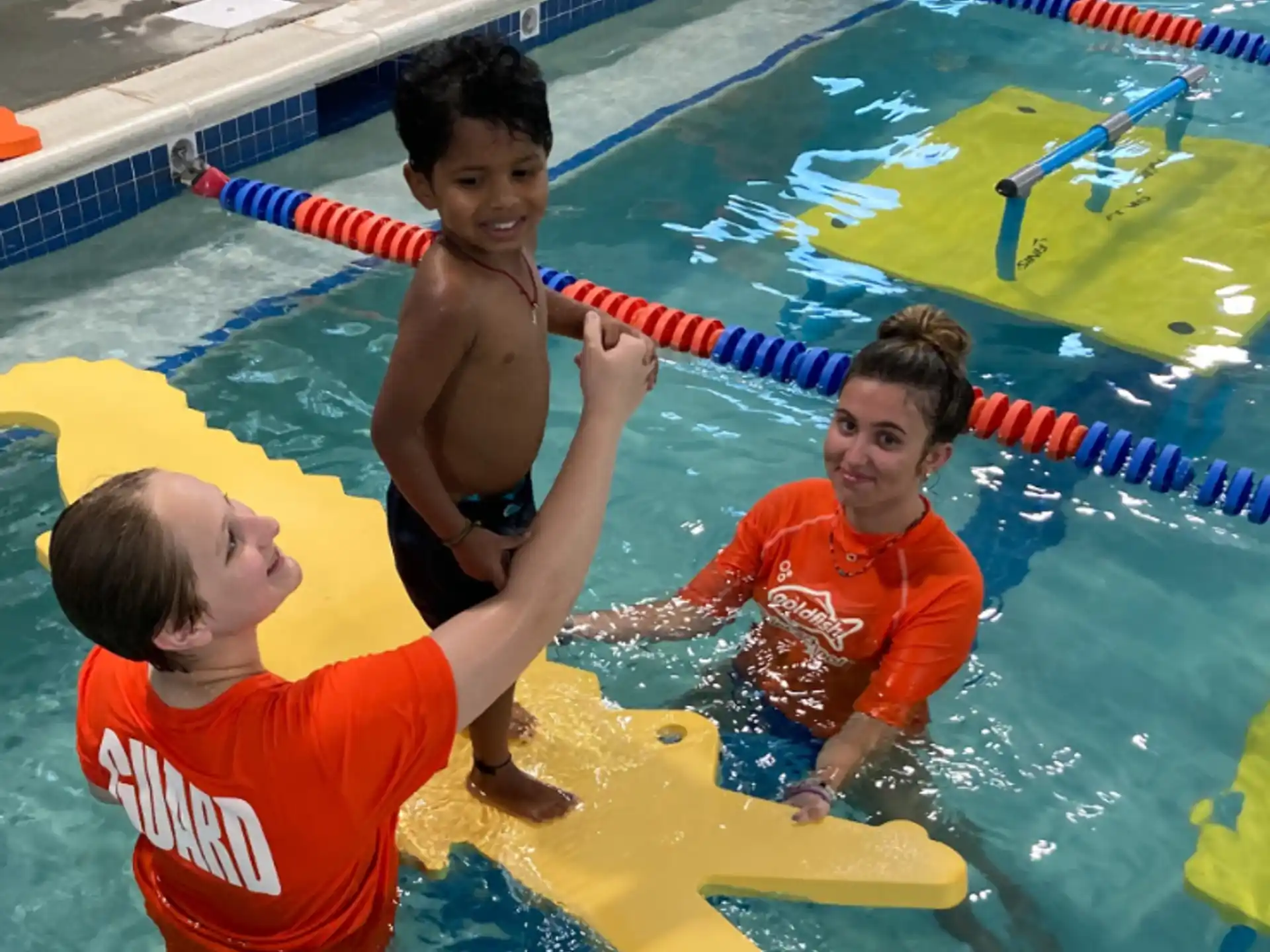 a group of boys in a pool