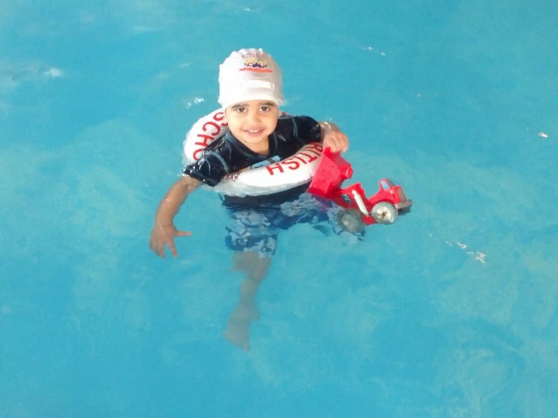 a boy in a pool