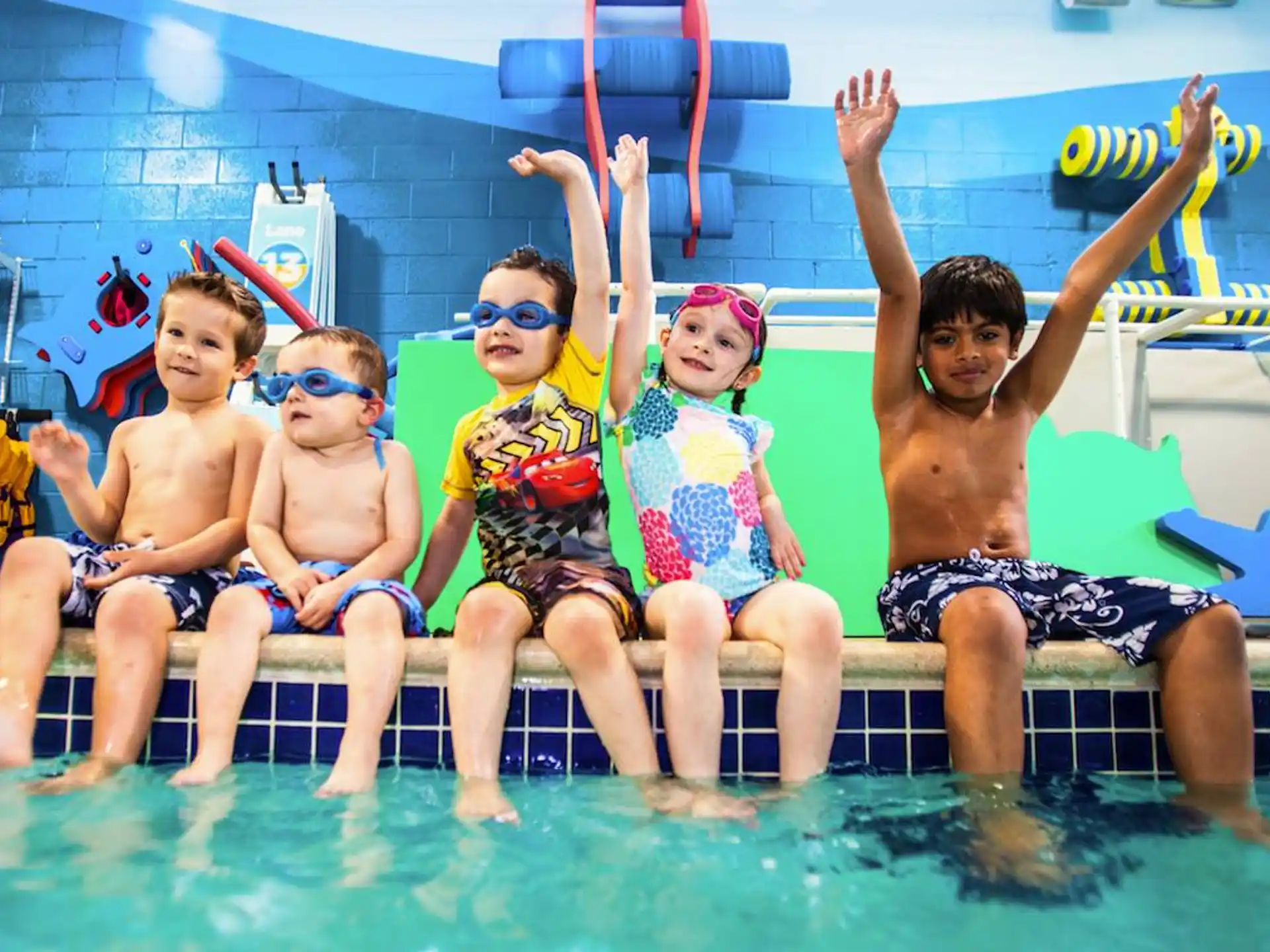 a group of kids in a pool