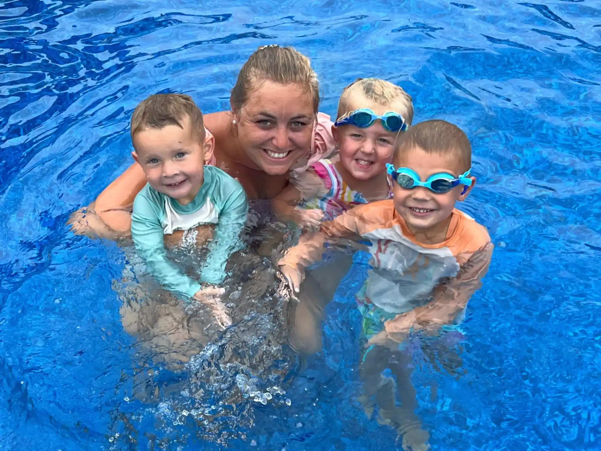 a group of kids in a pool