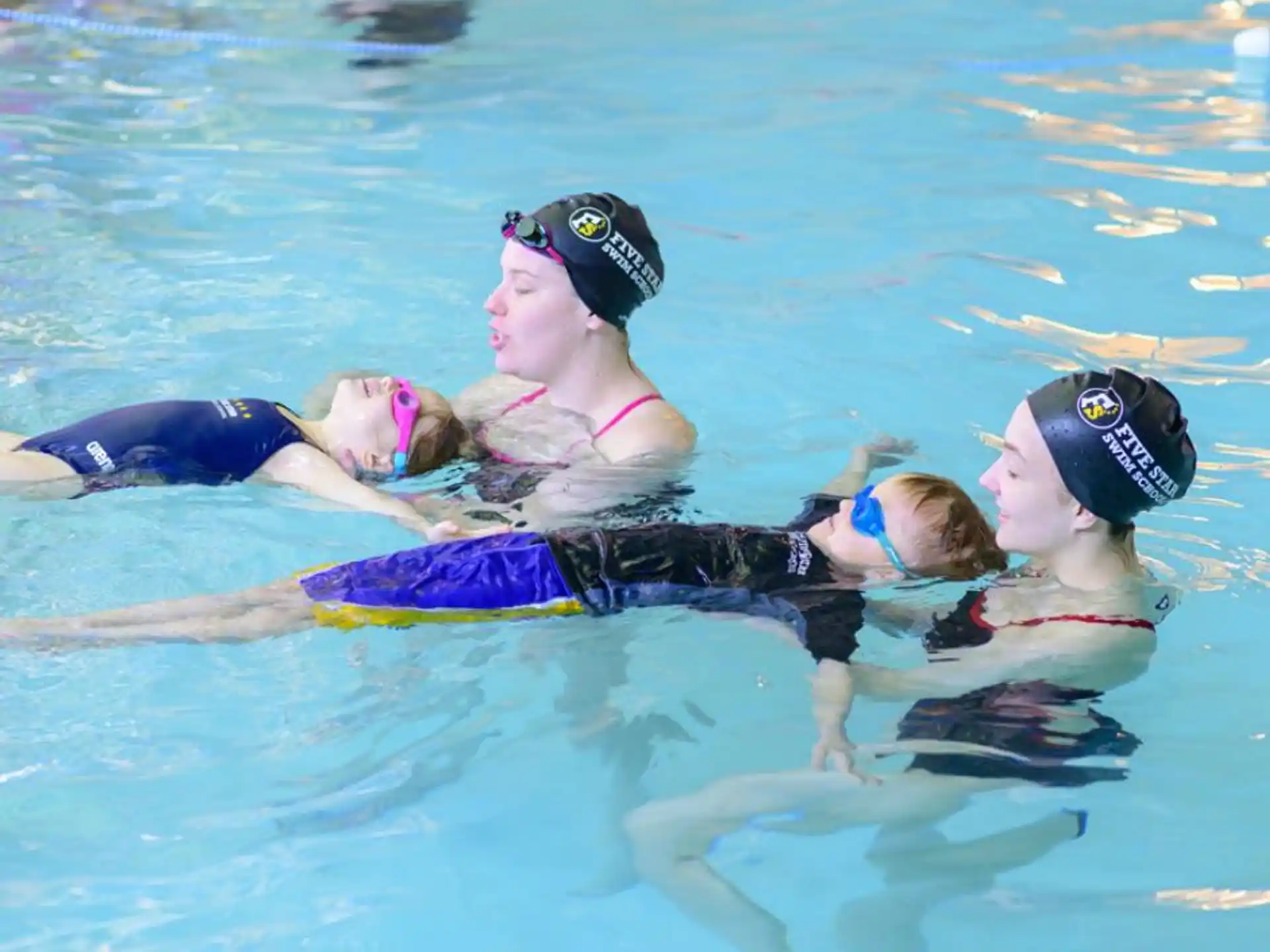 a group of people in a pool