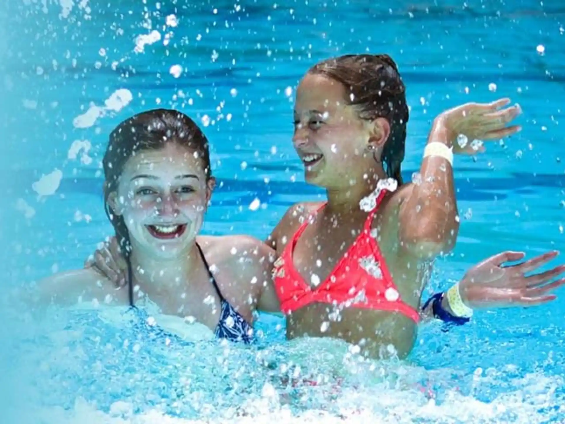 a man and woman in a pool