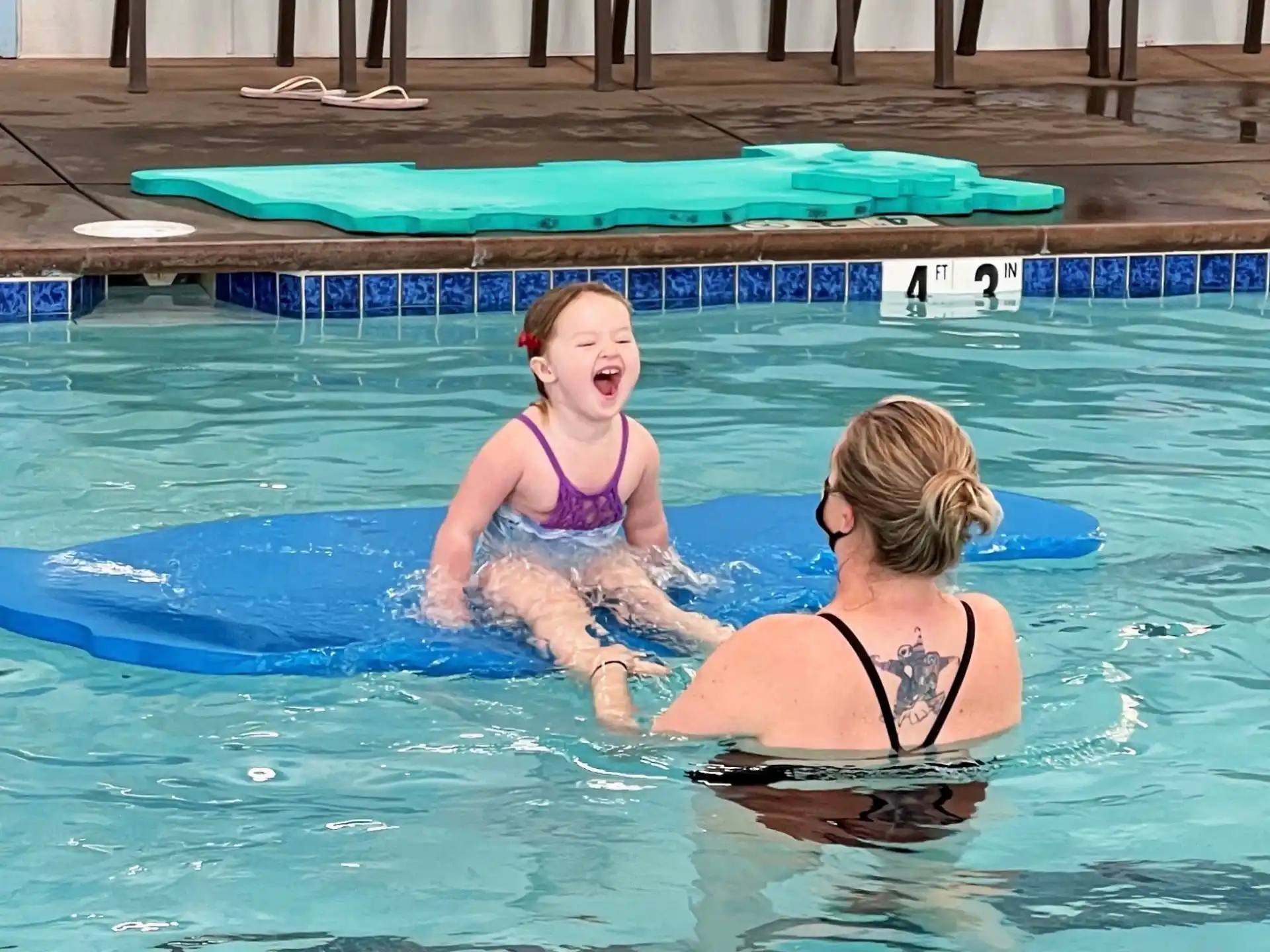 two women in a pool