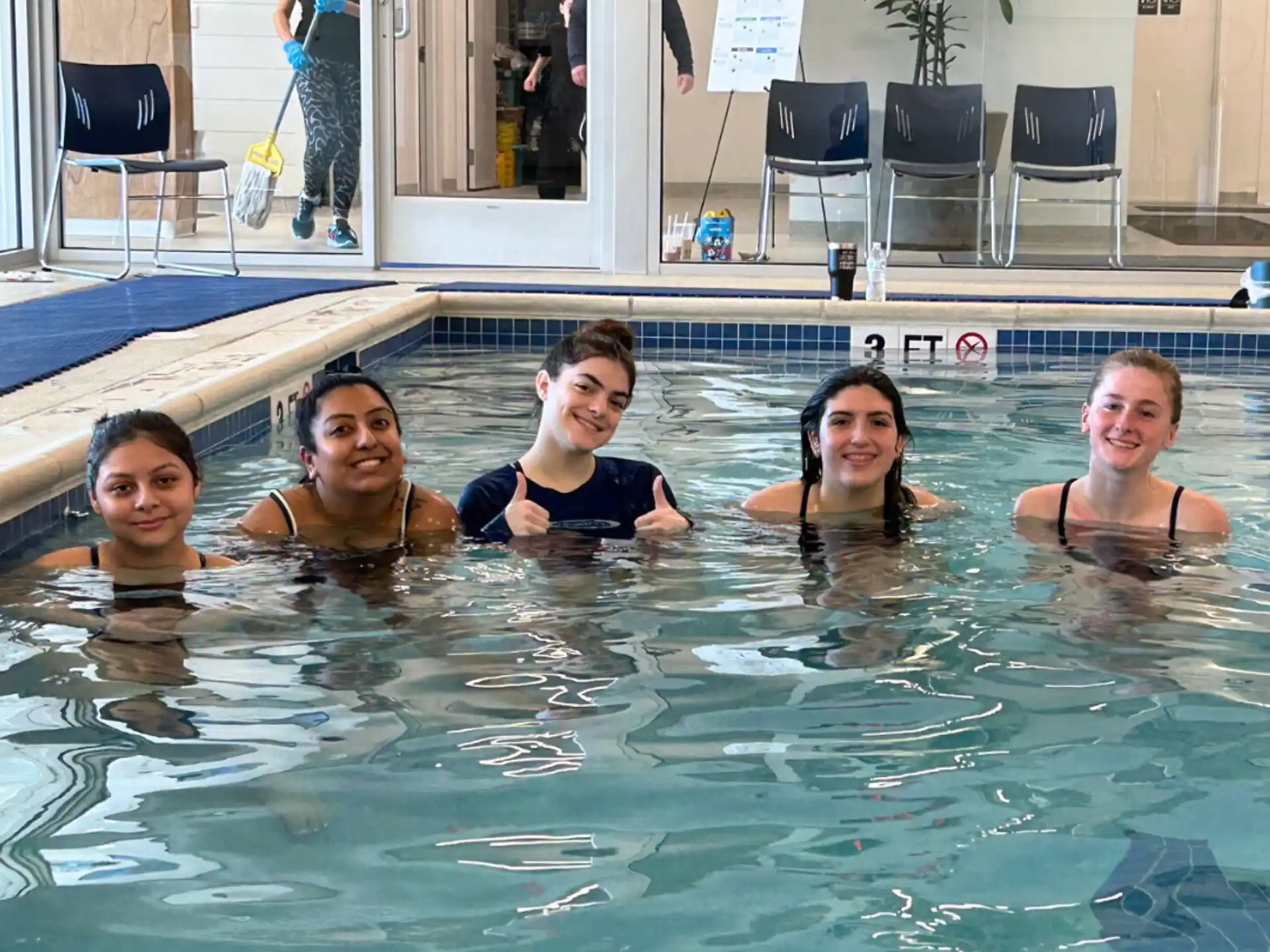 a group of people in a pool