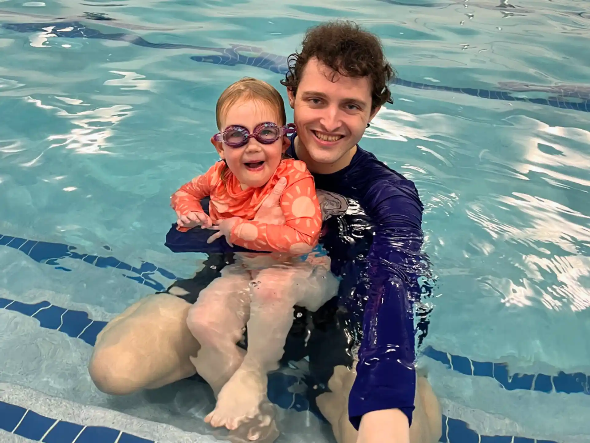 a man and a woman in a pool