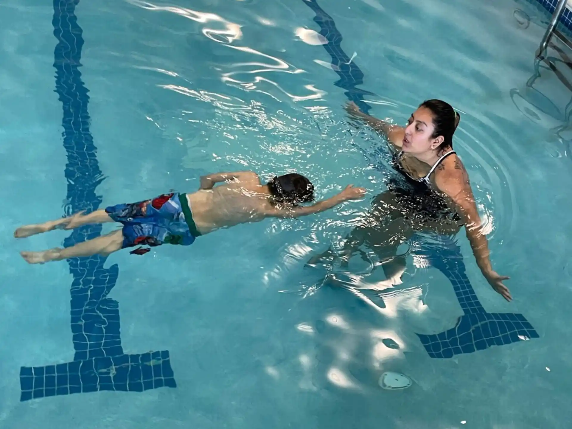 a man and woman in a pool