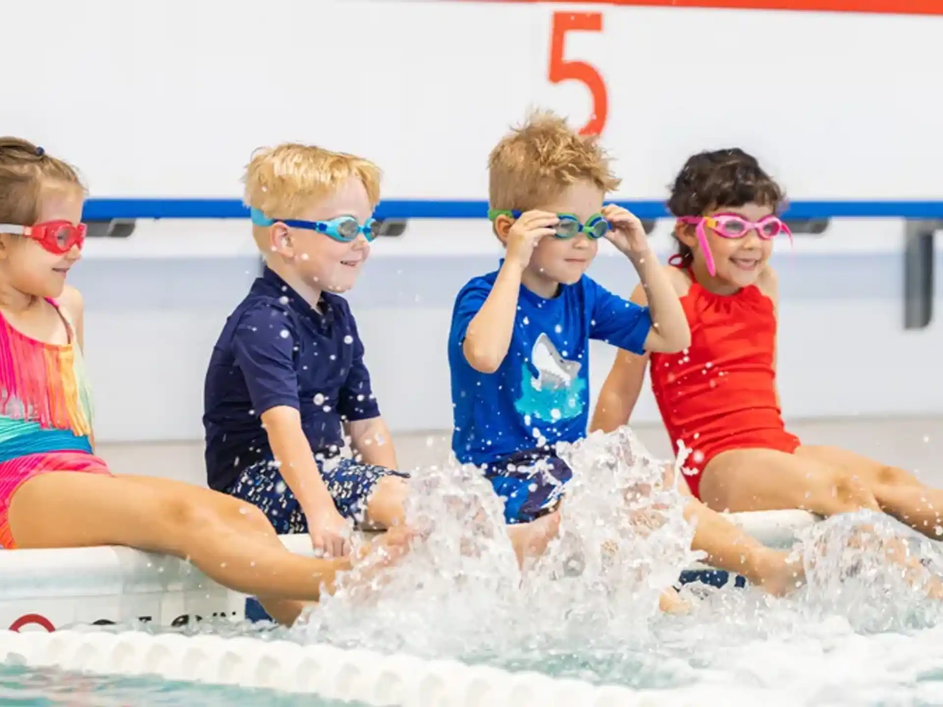a group of kids in a pool