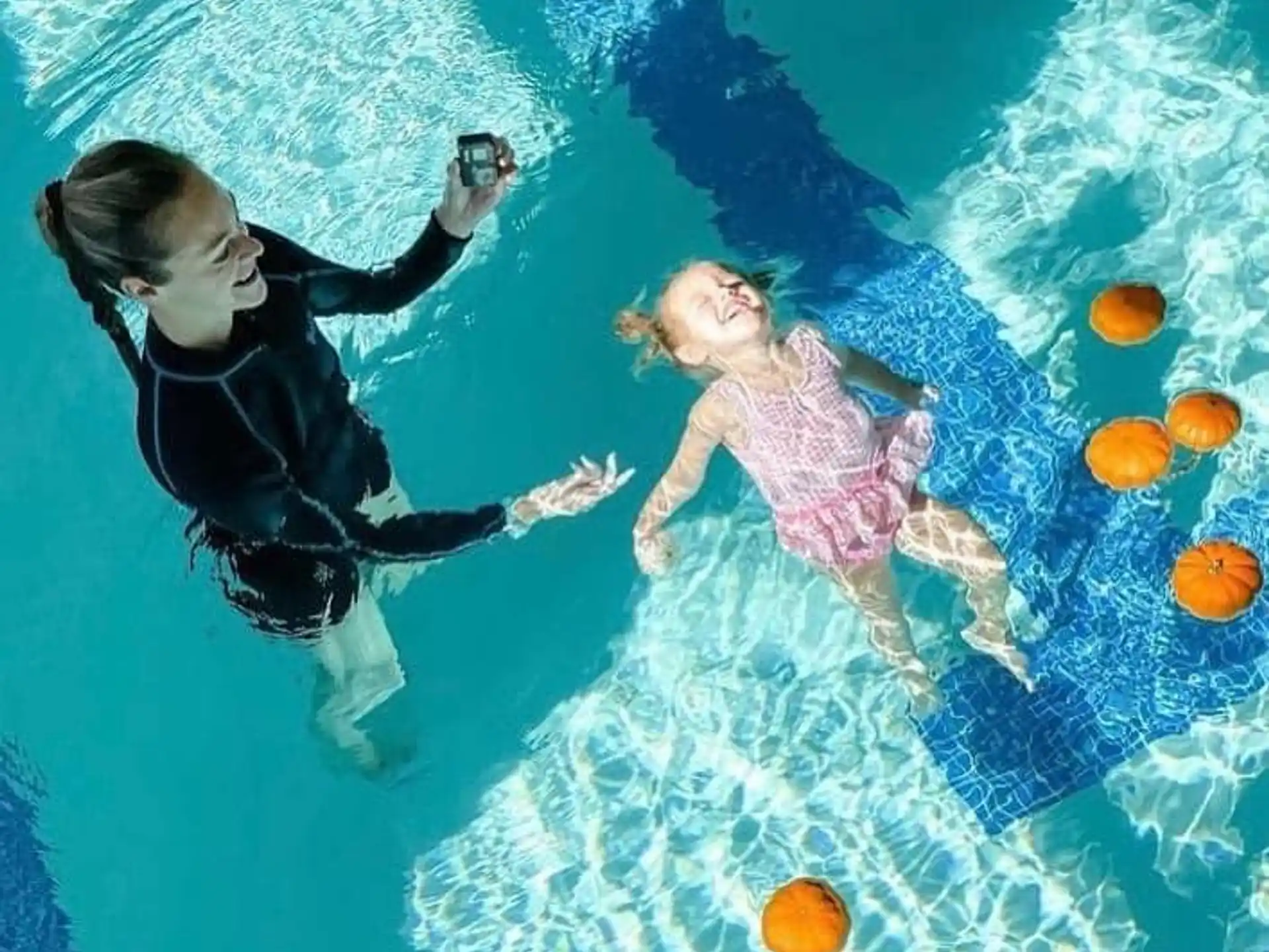 a man and woman in a pool