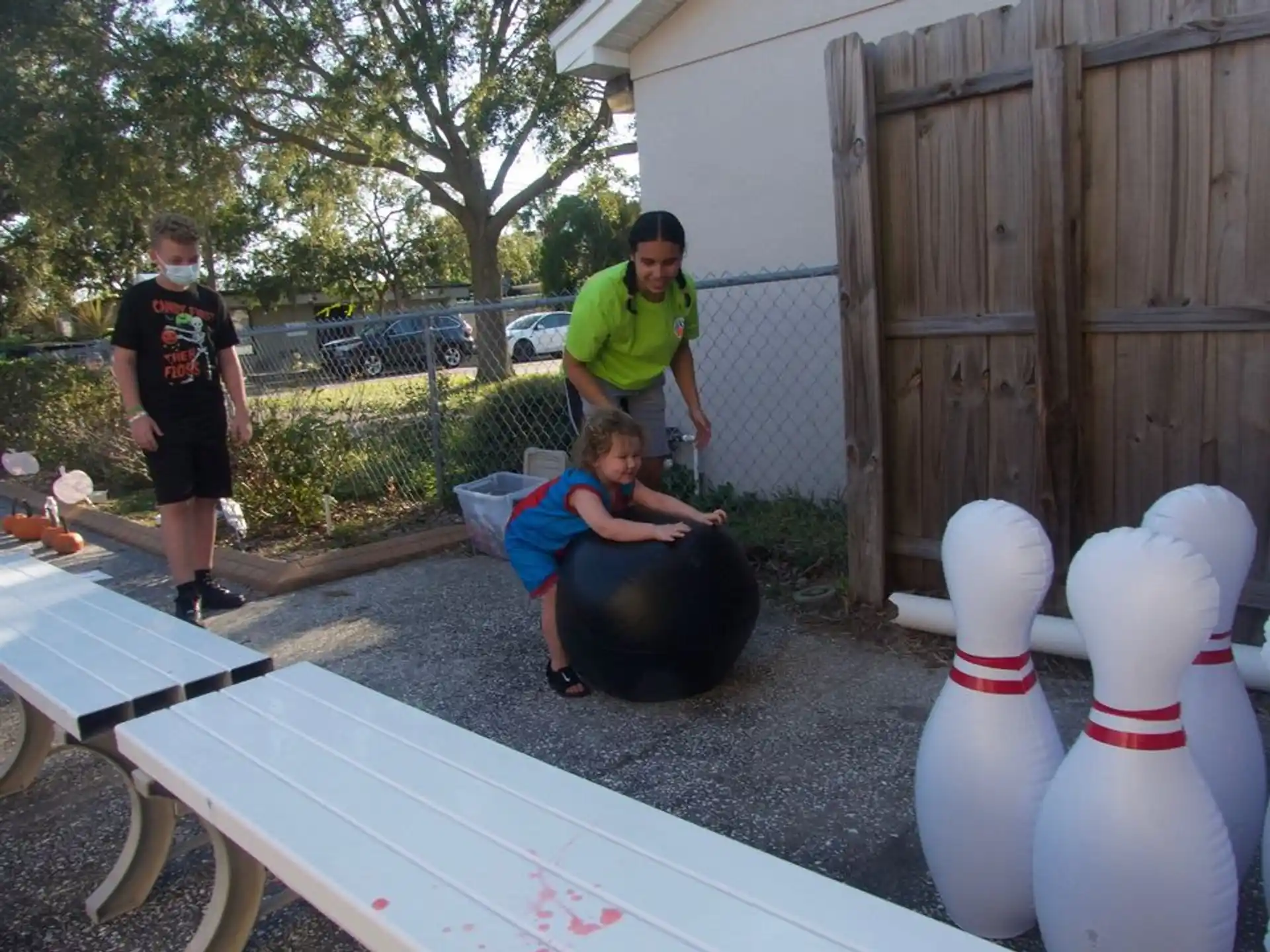 a group of people playing in a yard