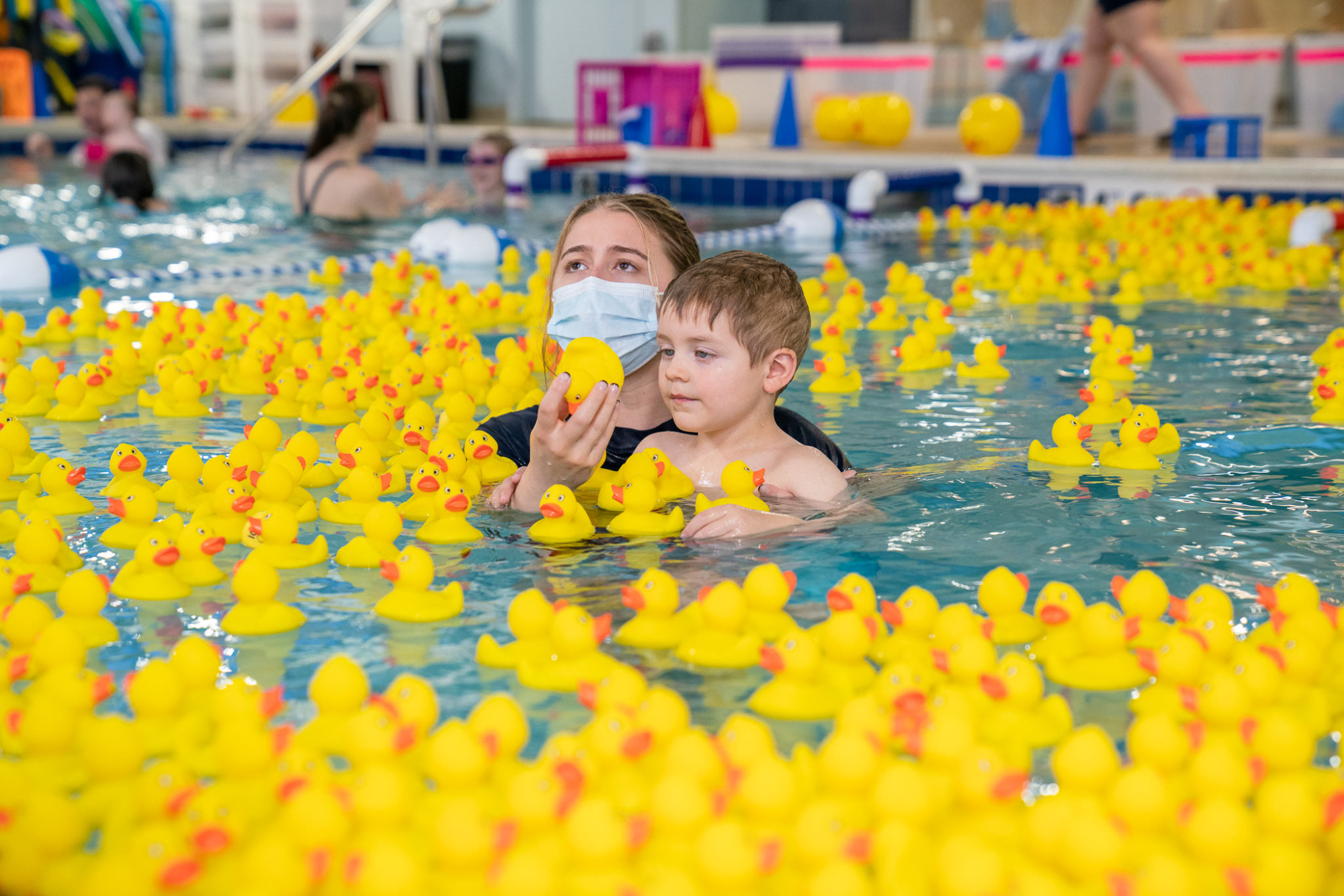 a couple of kids in a pool